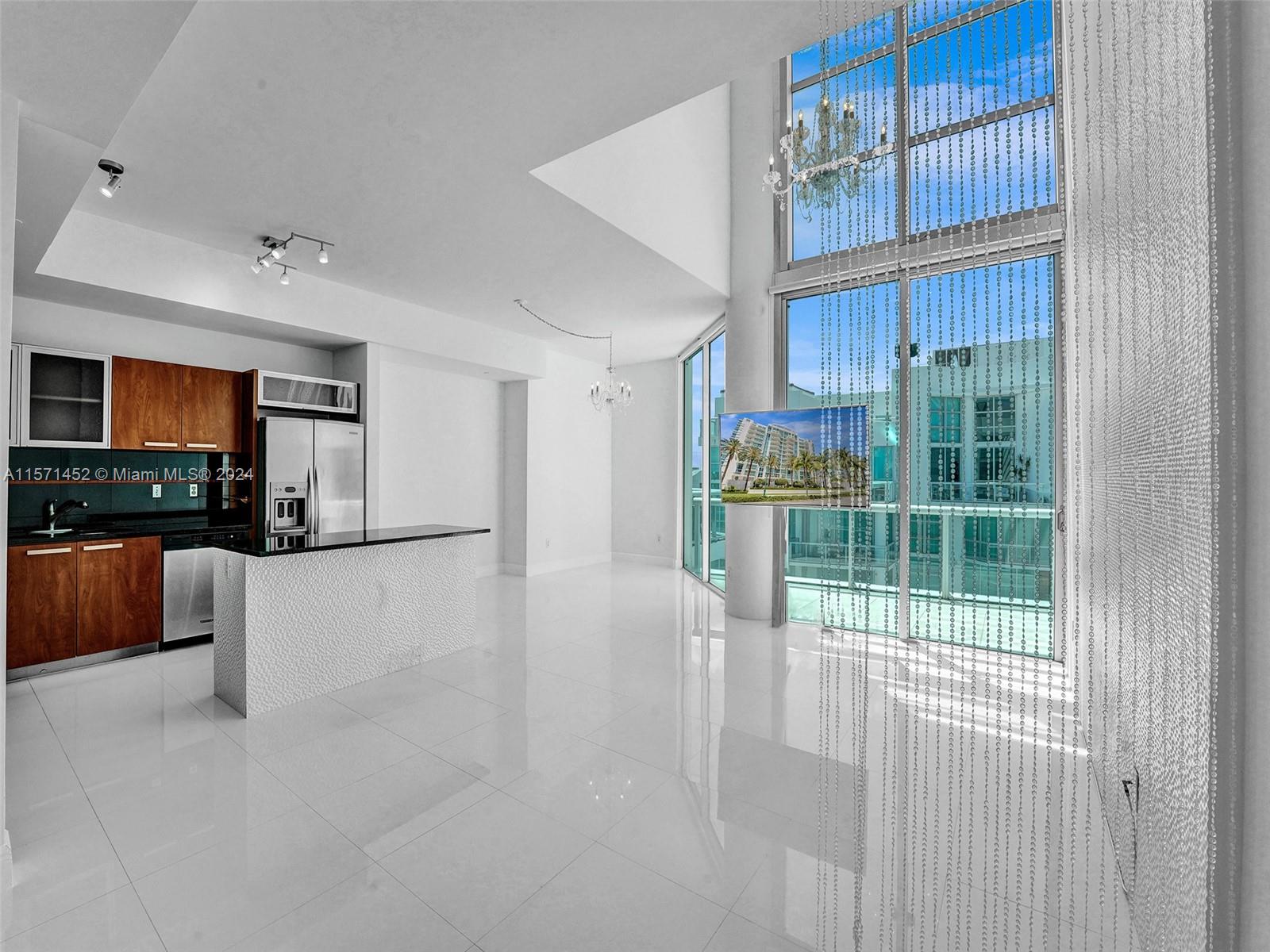 Experience luxury living in this stunning two-story penthouse in the heart of Aventura inside "The Atrium." Recently renovated, this bright, snow-white, and luxury residence boasts two bedrooms plus a den, two and a half baths, and not one but two private rooftop terraces offering breathtaking views. The kitchen features elegant granite countertops and brand-new Samsung stainless steel appliances. With valet parking, security, a pool, and a fitness center, every convenience is at your fingertips. Plus, enjoy proximity to Aventura's top school next door, shopping destinations, restaurants, and beaches. Live in style in this snow-white sanctuary! 360 DEGREE VIRTUAL TOUR AVAILABLE!