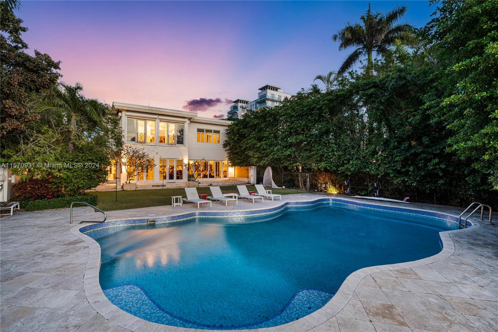 Gorgeous contemporary masterpiece nestled on this expansive 16,200 SF lot within the prestigious and guarded enclave Allison Island in Miami Beach. This Deco waterfront epitomizes perfection in every way. Completely renovated w/modern floor plan, perfect for entertaining. 6,200 sq, 7 bedrooms 5.5 bth + add'l bed/off/gym & 2 car gar. is move-in ready.Top-line Appliances & finishes with stunning water views, beautiful oversized  pool w/gls tiles & LED lighting. 45 KW gas gen. w/auto transfer switch & powers entire home. Stunning SUNSET WATERVIEWS.