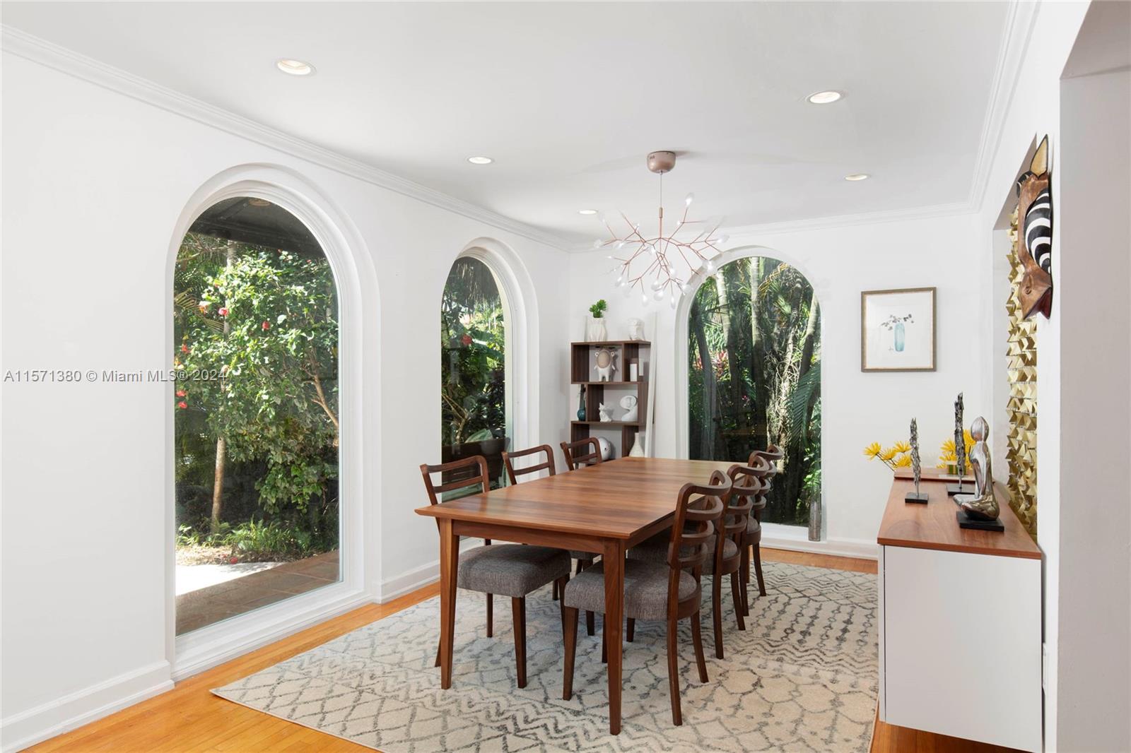 Fall in love with this ultra chic and charming villa in Coconut Grove’s most coveted community, the Utopia Homeowner’s Association. Enjoy a lush and idyllic street with a neighborhood feel while being minutes from top parks, schools, dining, and the bay. This inviting home seamlessly blends historic charm and modern design to be move-in ready. Abundant natural light, arched windows, hardwood floors, and wood-burning fireplace complement renovated kitchen and baths, flexible floor plan, impact windows/doors, and spacious primary suite with bonus space. Your tropical backyard oasis features a sparkling glass tile pool, Ipe wood deck, and outdoor shower. The detached guest house offers both privacy and comfort for all your family’s needs. The absolute best that the South Grove has to offer!