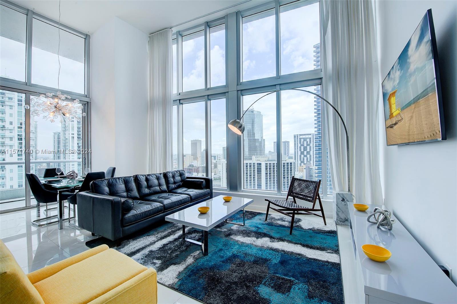 Rare 2/2 NE Corner Unit at Icon Brickell with 16ft. Double-height ceilings, Bay, and Ocean Views. Short-Term Rentals Permitted. Enjoy stunning views of Biscayne Bay, Miami River & Downtown skyline from floor-to-ceiling windows. Move-in ready. Ideal Miami vacation rental investment generating well over $100k Airbnb income. Top-notch management. Italian kitchen, Subzero Wolf Bosch appliances. Designed by Philippe Starck. World-class amenities: Heated infinity pool, movie theater, lush landscaping. Fine dining with Cipriani & LaVeinte in the building.