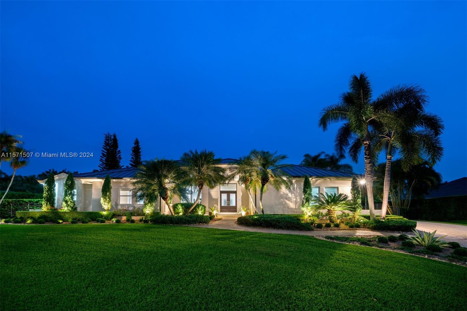 Nestled in the Palmetto Bay gated community of Flamingo Garden Estates, this 6-bedroom, 4-bath estate boasts 4,496 SF on a nearly half-acre lot. Imagine relaxing by the heated saltwater pool or jacuzzi or firing up the Kalamazoo grill and pizza oven in the gourmet outdoor kitchen surrounded by a beautifully landscaped backyard. The one-story layout features volume ceilings, grand double-height foyer, two living areas, formal dining, two offices, generous light-filled rooms throughout, and Sonos sound system. The chef's kitchen is equipped with top-of-the-line appliances and quartzite counters. Unwind in the principal suite with a sitting area, two large walk-in closets, and luxurious bathroom featuring a separate custom tub and shower. Designed to entertain, this can be your dream home.