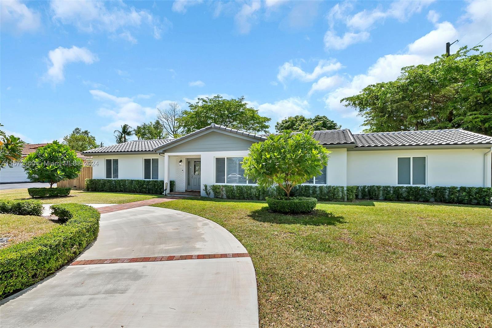 This stunning 4 bedroom, 2.5 bath north Palmetto Bay home with a screened pool is perfect for entertaining. Formal living and dining rooms. Updated kitchen with white cabinetry, quartz countertops, mosaic tile backsplash, stainless appliances and eat in snack bar, opens to family room. The 4th bedroom was converted into a den but could be turned back into a bedroom.  All bathrooms have been remodeled. Other upgrades include impact windows, indoor laundry room and a new roof. Side entry garage and circular driveway. Lovely fenced backyard with fruit trees. Don't miss out on this opportunity to own a piece of paradise in a desirable neighborhood, in a convenient location.