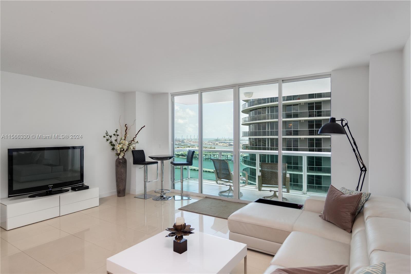 Large 1 bedroom, 1.5 baths, FURNISHED with south-east views of the Biscayne Bay and located in Edgewater, minutes away from Downtown Miami, South Beach, Midtown Shops, and the Design District. 1095 SqFt and 105 SqFt terrace. Very spacious living/dining area with spacious kitchen. Full service building with gym, sauna and steam rooms, heated swimming pool and 24-hour concierge, security, and valet parking services, plus additional bicycle storage. Across the street is Margaret Pace Park with Tennis/Volley courts, playground, outdoor exercise and water sports. 1 parking space included. Rent includes water, basic internet/cable. Close to the Metro mover, supermarkets, restaurants, art & entertainment centers. $1,500 security deposit due to association.