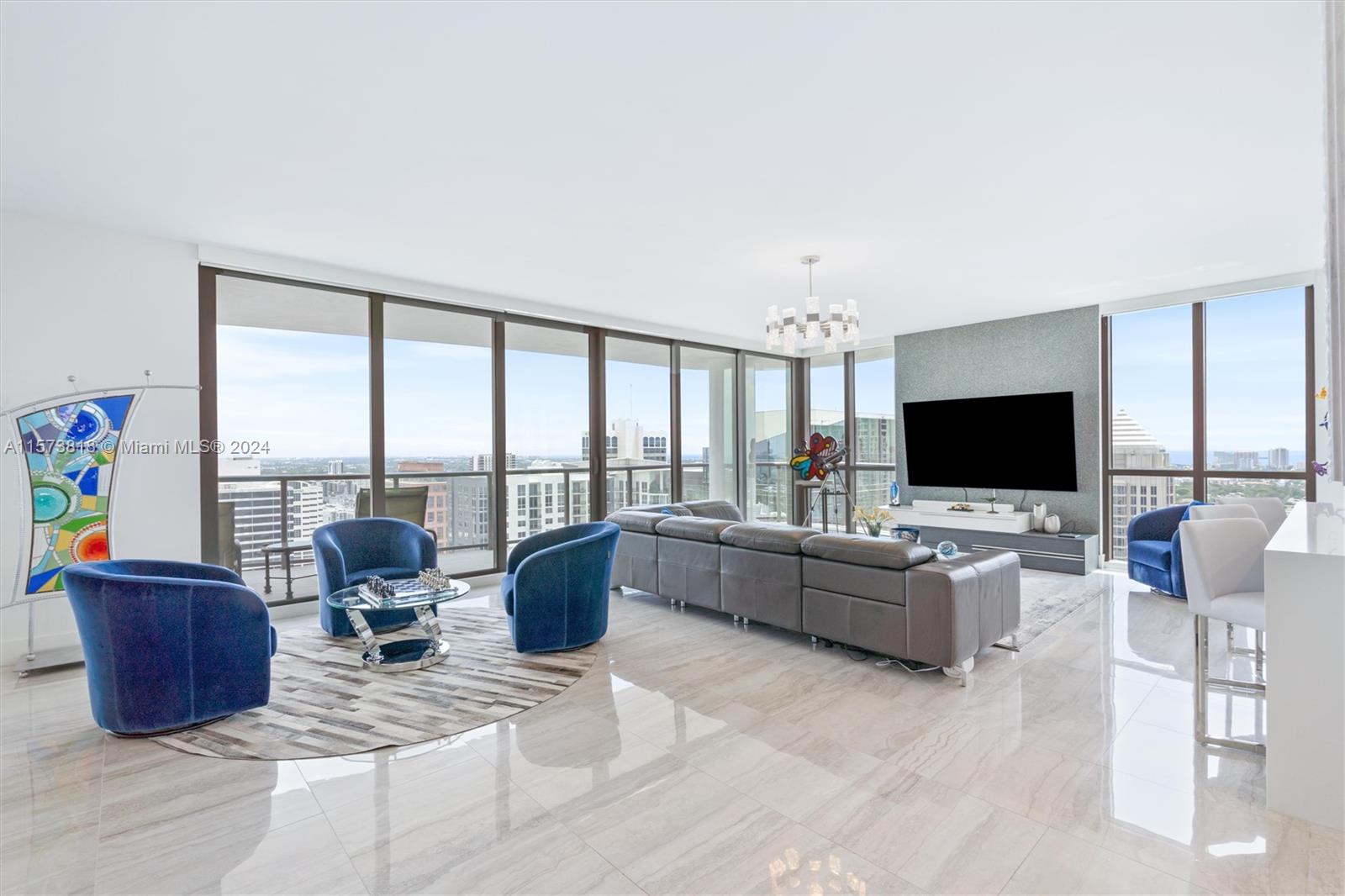 Las Olas Luxury Living at its finest! Unit comes with 3 parking spots!! Relax on a huge wrap around covered terrace, enjoying stunning sunsets over fantastic views of the city, river, and ocean. Floor to ceiling impact windows.