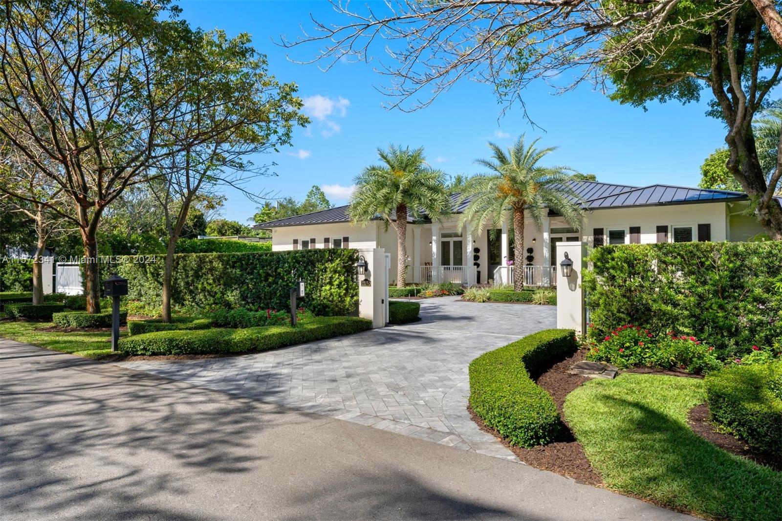 Built in 2019, this stunning 5,001 SF, 4-BD, 4-BA home is on a sizable 24,727 SF lot in a highly sought after Pinecrest neighborhood. The residence showcases beautiful curb appeal with a dual gated entry and charming covered patio. An eat-in gourmet kitchen offers quartz countertops, top-of-the-line appliances, floor to ceiling cabinetry, custom height adjustable built-in table with ample seating, and walk-in pantry. The open layout seamlessly connects the kitchen, dining, and family rooms with large sliding doors, merging indoor and outdoor entertainment areas. A beautifully landscaped backyard boasts a saltwater pool, covered patio, and privacy hedges. Additional features include a whole-house generator, high impact windows and doors, and 2-car garage.