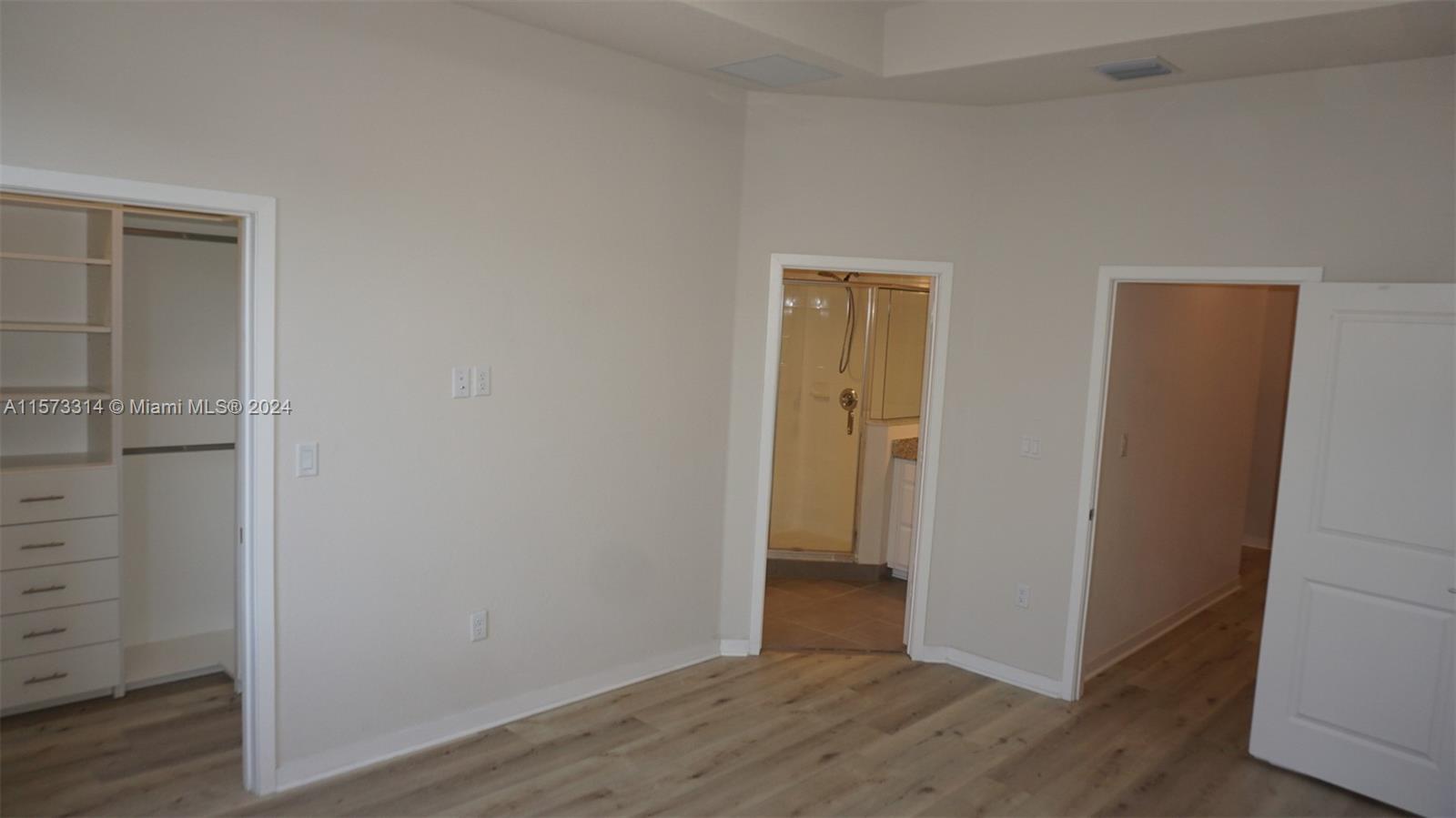 View to walk-in closet and master bathroom