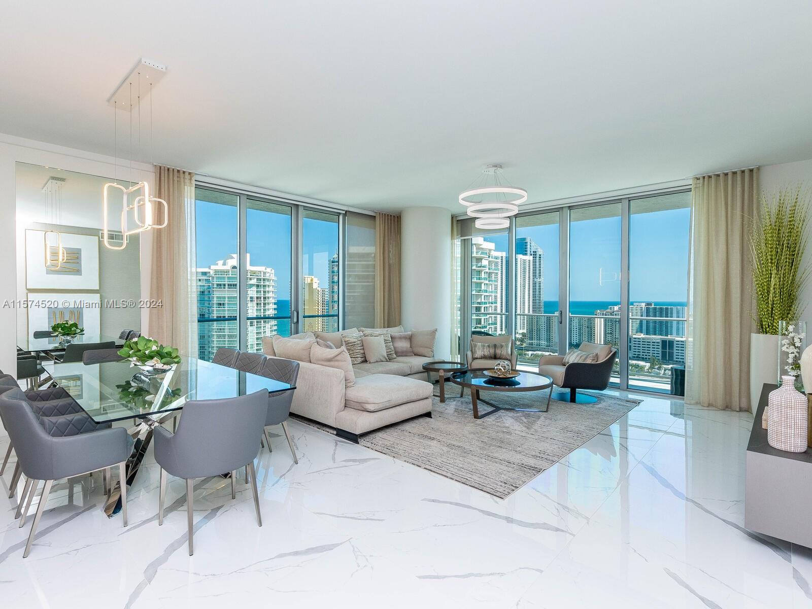 Fantastic furnished unit in Sunny Isles, close to the beach, with 5 stars amenities. Tastefully upgraded 3 bed/3.5 bath, corner unit, high floor and high ceilings, wrap around terrace with stunning panoramic views of Intracoastal, Miami skyline & Ocean. Designed by Steven G with finest furniture and beautiful decor and lots of upgrades.  Open floor plan, floor to ceiling Impact glass windows & doors. Gourmet kitchen, quartz Countertops, induction stove, Italian cabinetry, Bosh & Subzero appliances, Italian closest and doors, electric blinds, beautiful porcelain floors. Luxurious amenities:24/7 front desk & Valet, 4 pools, Gym, Spa, Kids Club & Playground, Cinema, Games room, Bistro, Party room. Near the beach, Aventura Mall & Bal Harbor Mall. Awesome​​‌​​​​‌​​‌‌​‌‌‌​​‌‌​‌‌‌​​‌‌​‌‌‌ Schools.