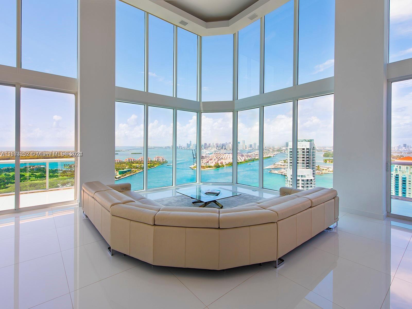 It really doesn't get better than this! Spectacular 3-story Lower Penthouse in the best neighborhood of one of the most coveted cities in the world...SOFI of South Beach! Infinite views of Biscayne Bay, Fisher Island, Downtown Miami skyline, South Beach, Port of Miami, the Atlantic Ocean and glorious sunsets. Penthouse has 20' ceilings with huge floor to ceiling windows, expanses of glass, a 2,300 sq. ft. rooftop outdoor terrace and working kitchen, oversize primary beddroom, top of the line appliances, sound system. Impeccable, luxurious and very sexy! 3 bedrooms, 3 1/2 baths plus great office. Expansive common area. Watch the technicolor sunsets and the cruise ships majestically departing Port of Miami. World class views are truly unforgettable! Small dogs on case by case.