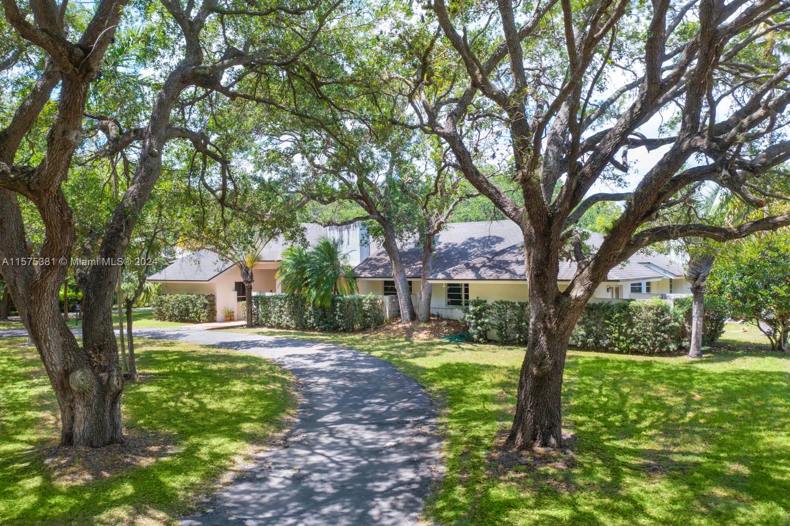 Prime North Pinecest oak-laden acre home on one of the most desired and private streets in the best area of Pinecrest. Develop or renovate/expand the existing home (which has been leased for the past 4 years) and contains a nice livable 4/3.5 with some minor recent updates.  Gorgeous lot will mature landscape and trees mainly on the perimeter make this an ideal lot to work with.