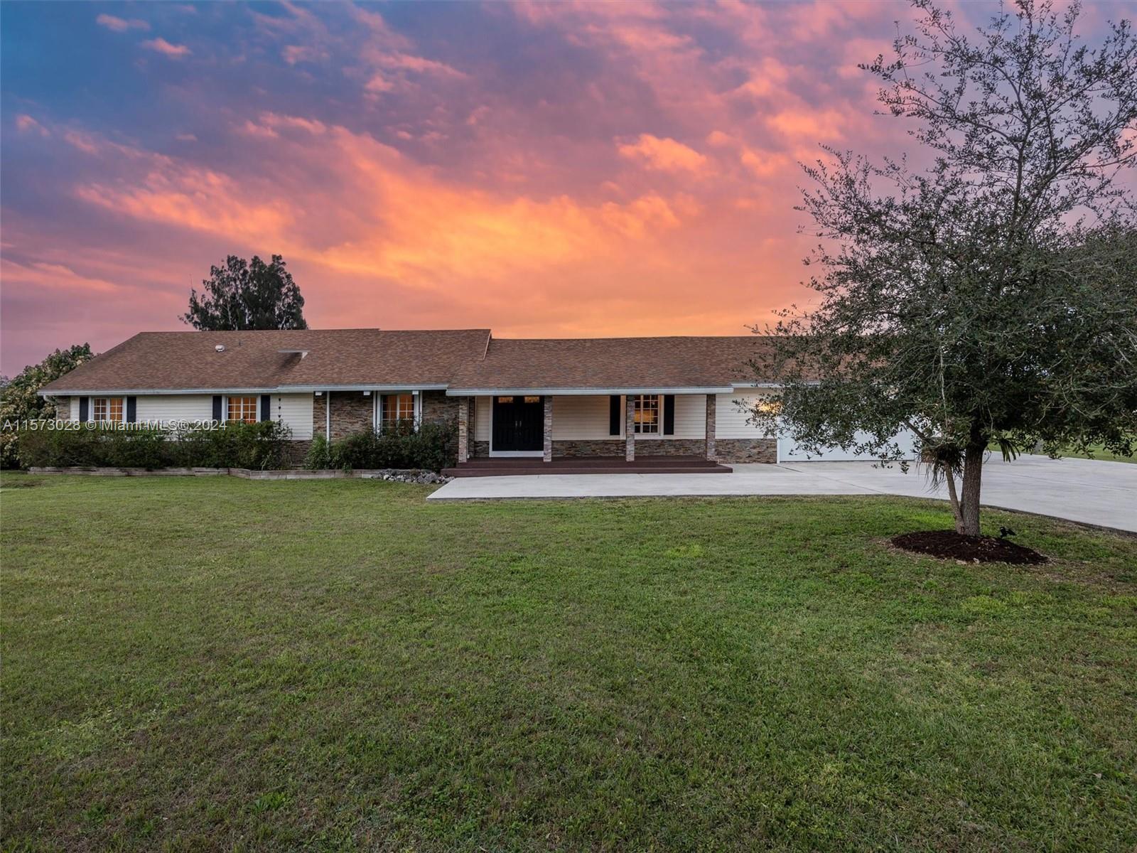 Relocate to the Redland & enjoy a spacious & beautifully updated 3-bed, 4-bath home on 2.5-acres. The residence features a gourmet kitchen with a gas stove & a convenient pot filler, complemented by open living areas enhanced by cedar wood ceilings & lifetime-guaranteed bamboo flooring. An outdoor oasis awaits, complete w/ a large pool, spa, & a generous patio, ideal for entertaining. Utilize the 6-car garage capacity, offering ample space for hobbies, storage, or potential living area. The property is fully fenced w/ auto gate access & hosts a variety of fruit trees, which could qualify the property for an agricultural exemption. Located a short drive from Miami, this home combines rural tranquility w/ suburban convenience, perfect for those seeking a peaceful retreat w/ easy city access.