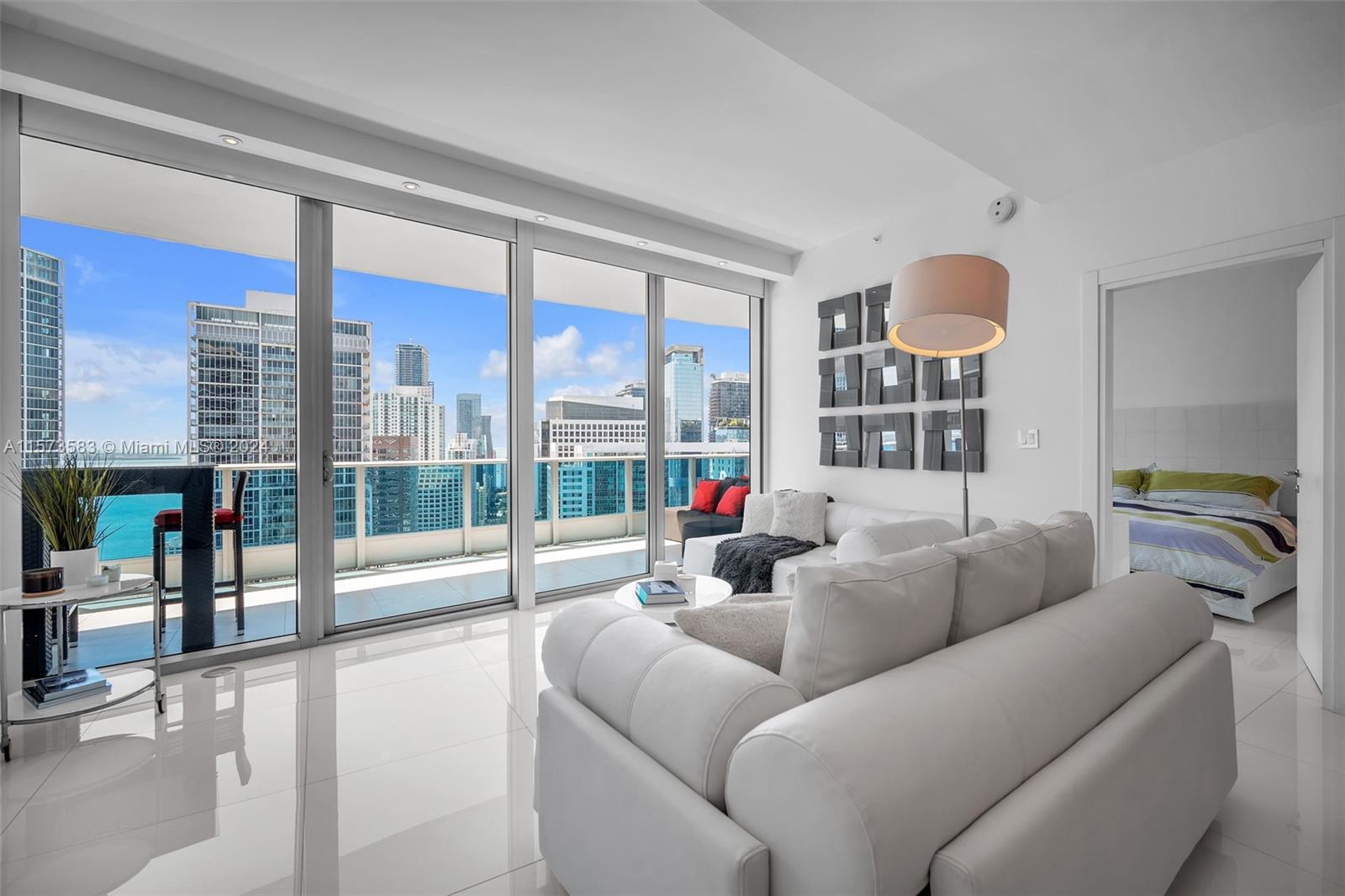 Immerse yourself in luxury in this stunning 2-bed, 2.5-bath home at the incomparable Epic Miami. Floor-to-ceiling windows flood every room with sunlight, revealing 180-degree waterfront & cityscape views. The chef’s kitchen boasts a Subzero fridge, Miele oven, dishwasher, & cooktop.  Includes stylish furniture, large storage on the same floor ($97k value) & a second storage near your private parking space - both under AC. Enjoy amenities like room service, a state-of-the-art gym, full-service Privai Spa, 3 private residents’ & 2 hotel-shared pools with poolside bar and restaurant service. Acclaimed dining venues Zuma & Area 31 on property. Ideal for walkability to Whole Foods, fine dining, and upscale shopping. The Epic Condo embodies the pinnacle of luxury real estate in Miami.