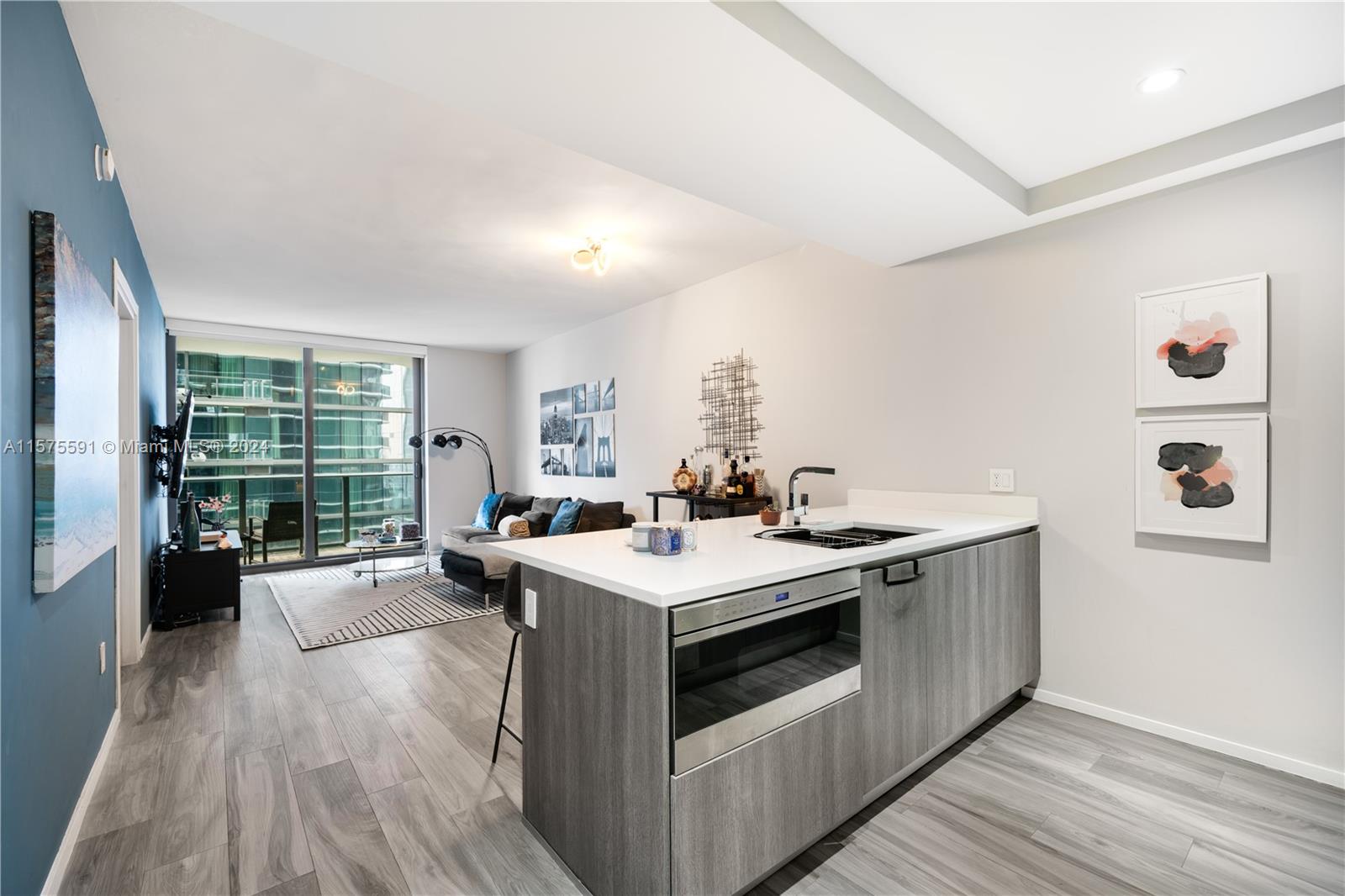 Located in the heart of Brickell, this contemporary 1-bedroom, 2-full bathroom + den condo at the SLS Lux is a must-see! The residence is located off of a private elevator with biometric technology and features electric blinds throughout, a fully finished walk-in master bedroom closet, Smart Home Technology with a control pad, Sub-Zero and Wolf appliances, Italkraft cabinets, an in-unit washer/dryer, floor-to-ceiling windows, a spacious terrace and a rain shower and spa tub in the master bathroom. The luxury building boasts premium amenities including a full-service spa, tennis court, fitness center, 57th floor pool and sun deck, 44th floor sky lounge, 9th floor outdoor pool with TV’s and accompanying cabanas, al fresco dining, kids play room, basketball hoop and concierge services.