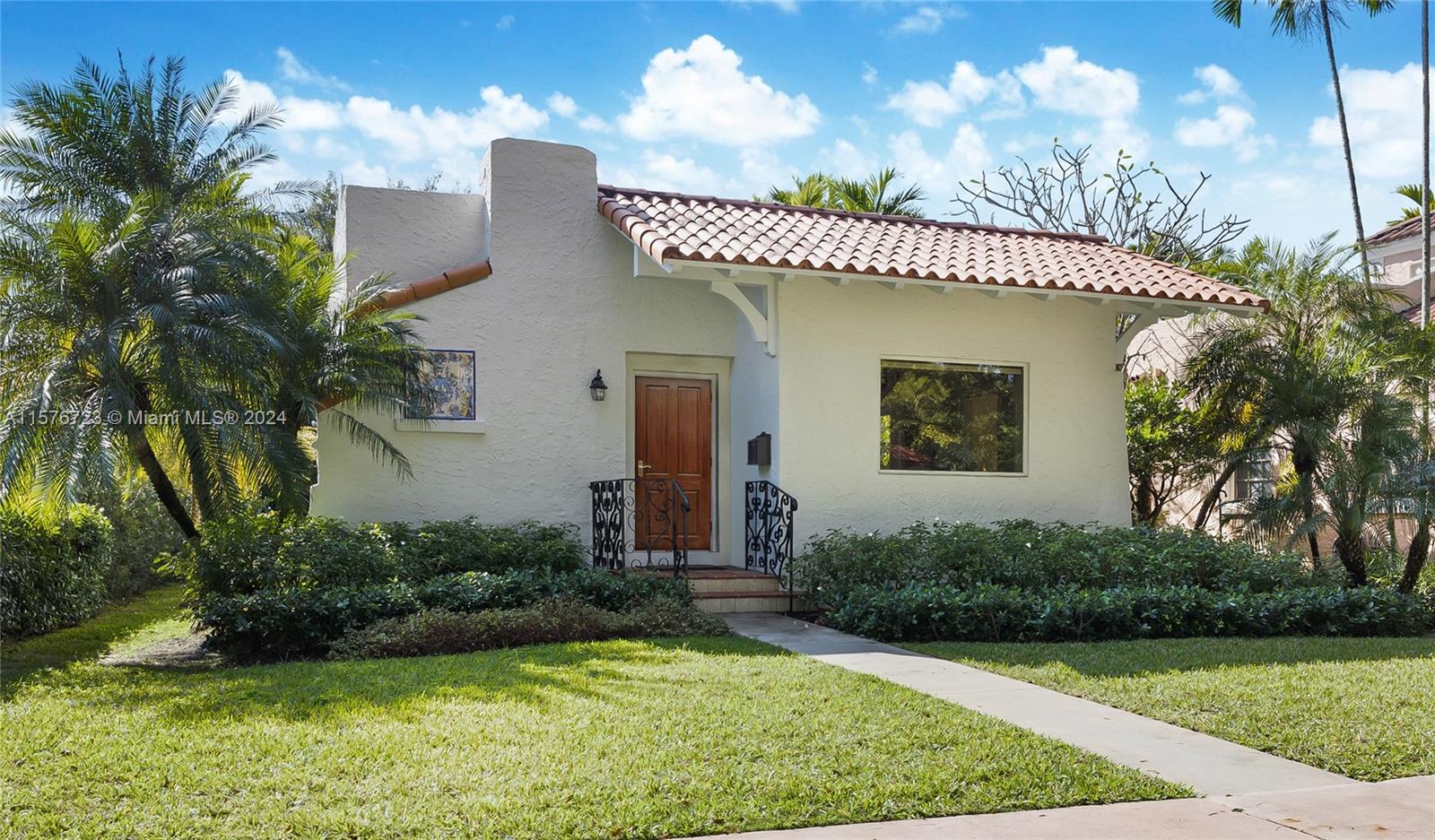 Situated in a PRIME location, on a beautiful, tree lined street in Coral Gables, this historic home designed by H. George Fink, is located steps from Granada Golf Crs, Biltmore Hotel, Salvadore Tennis Park & Coral Gables Country Club.This updated modernized 2 bedrm home with add'l den/library features impact windows & doors. Open floor plan featuring spacious living rm/dining area. The oversized primary bdrm includes a walk-in closet & offers private garden vistas thru French doors w/ sidelights. The master bath is luxurious w/ shower & double sinks. The kitchen includes panel ready & fully integrated top of the line appliances w/green tea granite countertops. Enjoy breakfast or cocktails on the back patio. Second bdrm works as a guest room or office with built in desk and library/bookcase