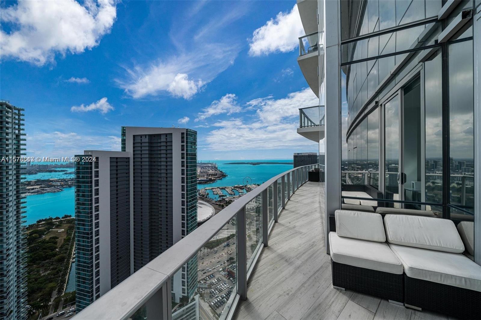 Welcome to the absolute most stunning 2bed/3bath + den with direct water view on one of the highest floors with rare huge wrap around terrace at Paramount Miami. Features include: private elevator, direct water view, huge terrace, floor to ceiling windows, 10 ft high ceilings, white tile floors, marble backsplash, gourmet kitchen w/Bosch and Sub Zero appliances, split floor plan, huge master bathroom w/sunken tub & shower, large walk in closet, spacious den that also could be converted into a very nice offers or storage, washer/dryer area, spacious second bedroom with private bathroom. This is one of the highest floor 03 lines with direct water view and rare wrap around terrace. Have access to world class amenities: basketball, tennis, 5 pools, boxing, spa, gym, shopping and more.