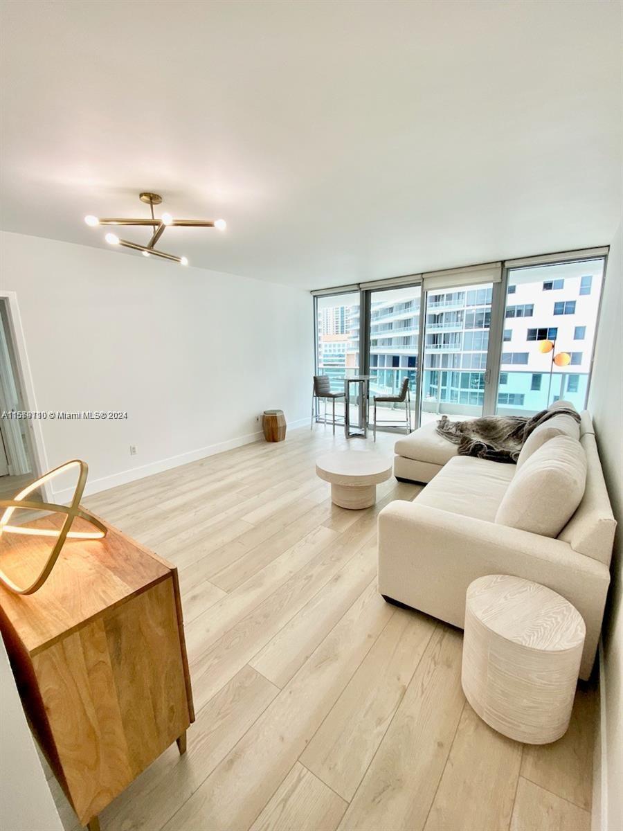 Offered furnished or unfurnished.  Brickell’s best waterfront building! Enjoy urban, upscale, 5-star living from this oversized unit with a large balcony. Upgraded kitchen and bathrooms, Miele and Subzero appliances, large whirlpool hot tub, Amenities include a bayfront infinity-edge pool and jacuzzi, gym and spa, complimentary valet, 48th floor Club Room, racquetball court, bicycle storage room, 24-hour concierge and security, kids playroom and much more. The unit comes with one indoor parking spot and an additional complimentary valet. Furnishings are completed by an award-winning designer, using high-end pieces from Restoration Hardware and William Sonoma