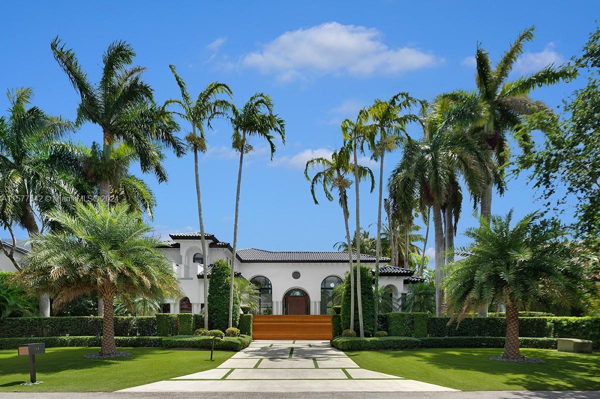 Step Inside With Me! This Cocoplum Modern Mediterranean is located in one of America’s wealthiest enclaves: Coral Gables. Contemporary design is defined by 18’ ceilings in the grand salon, custom millwork, bright interiors, and a white oak statement staircase. The open floor plan allows for formal and informal living, all delighted with water vistas. Outfitted with a natural stone wall, the dine-in kitchen features Wolf & Subzero appliances surrounded by picture windows. The showpiece primary suite offers dual walk-in closets, a spa-like bath, and private terrace overlooking the calm canal. The resort style pool & sun deck experience privacy from lushly landscaped, manicured grounds. 100+ ft of boater-friendly waters, privacy gate & a garage with lifts complete this estate.