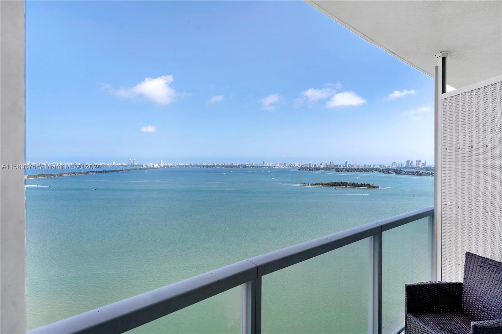 Bright bayfront condominium with beautiful, unobstructed views of the Intracoastal and Miami Beach.  Split floorplan with two spacious bedrooms (both with en-suite bath) plus half bath. Separate balconies for master bedroom and living room. Kitchen is open to dining and living room areas. Hurricane impact glass. Onyx on the Bay is a bayfront building with generous amenities, including well-equipped gym with sauna and steam rooms, bayside pool, hot tub. Sunset garden and dog walk area on 8th floor. BBQ. Party room with large TV. Billiard room with sports bar at lobby level. One assigned, covered parking space. Complimentary visitor parking. No valet. Short drive to Wynwood, Design District, Miami Beach, downtown Miami. Seller has paid the assessment. SEE VIRTUAL TOUR VIDEO.