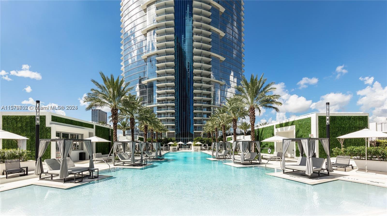 Experience luxury living at the new Paramount Miami World Center with this fully furnished 3-bedroom apartment. The unit has a private entrance, European kitchen, oversized balcony, shades, and walk-in closets. Steps away from numerous attractions, including the Miami-Dade Arena, Port of Miami, Brightline and Metro Mover Stations and Bayside. The building offers unparalleled amenities such as a basketball court, five pools, a recording studio, and tennis courts, making it one of the most desirable buildings in Miami. This spacious unit even includes a third bedroom, a private elevator foyer, and a large terrace to take in stunning city sunset views. AVAILABLE UNTIL DEC 1st ONLY !!!