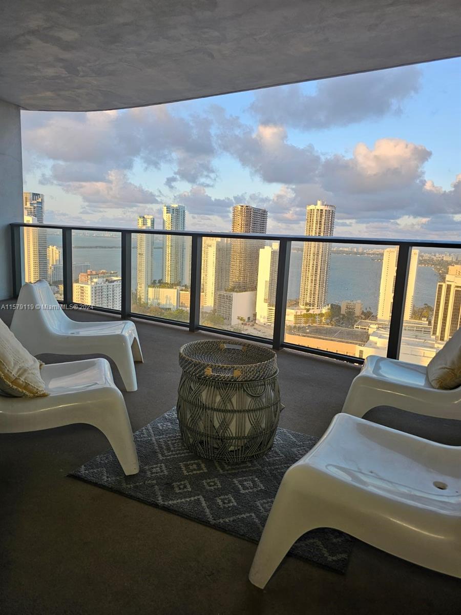 1 BEDROOM + DEN / 1.5 BATHROOMS...
Welcome to your future oasis in the heart of Miami! This FULLY FURNISHED exquisite rental property offers a serene retreat with its private balcony that boasts breathtaking views of the Biscayne Bay and the bustling Port of Miami. Imagine starting your day with the sunrise reflecting off the water, or winding down as the city lights begin to twinkle across the bay.

Nestled in the vibrant Downtown Miami neighborhood, it's 15 min. to the Miami International Airport, 5 min to the cruise port and train station making travel a breeze. The location couldn’t be more perfect for those who crave the excitement of urban living, with the best of Miami’s dining, shopping, and entertainment at your doorstep.