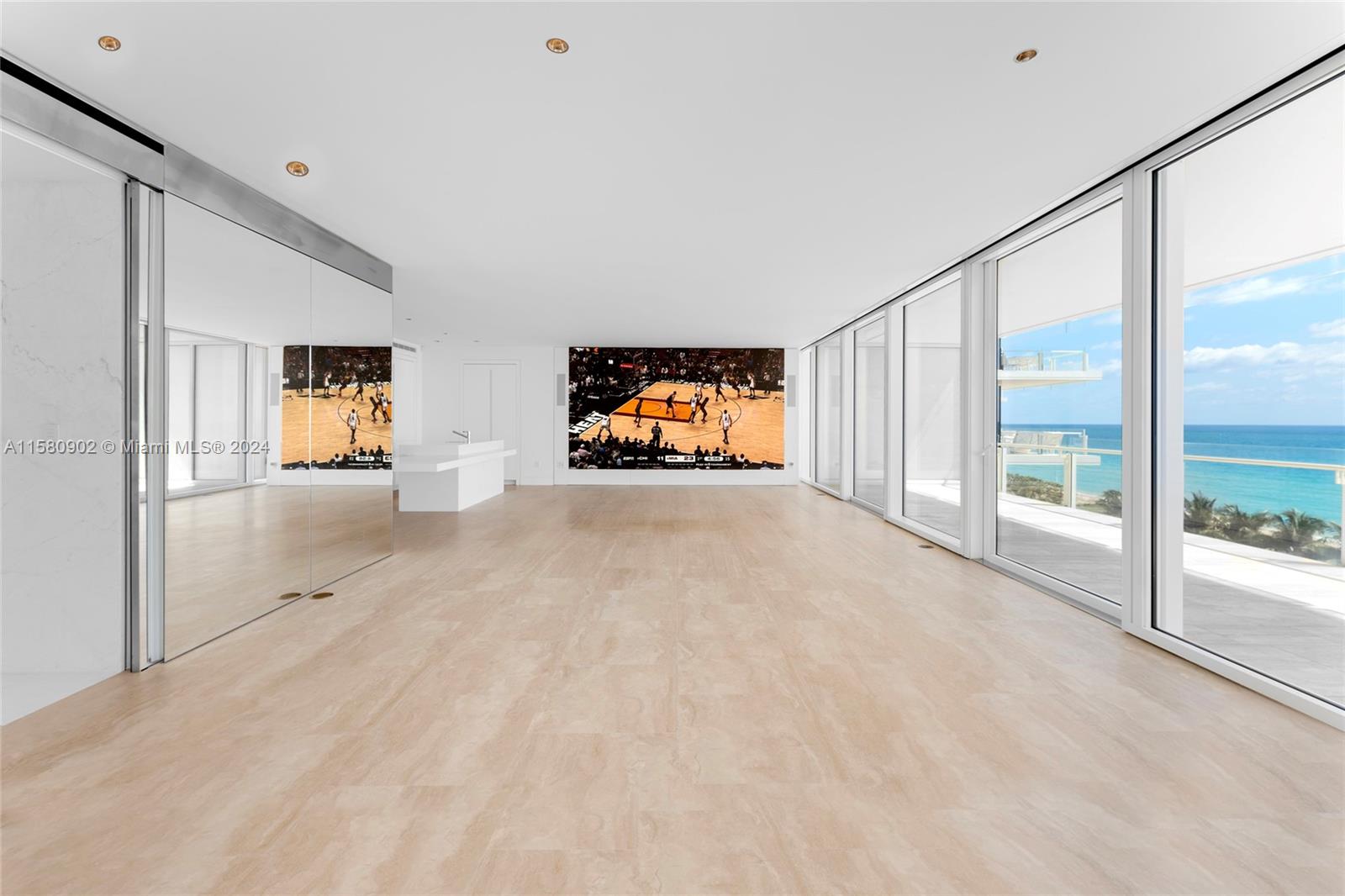 This stunning corner unit at the exclusive Surf Club boasts a large oceanside terrace with breathtaking ocean views. Features include 2,031 SF, & exquisite Travertine floors inside that extend to the oceanside terrace. An open living/dining area showcases an impressive custom-built state-of-the-art digital TV wall and floor-to-ceiling glass doors leading to the terrace. A sleek chef’s kitchen sports top-of-the-line Miele appliances, Sub-Zero refrigeration, and custom cabinetry. Principal suite offers floor-to-ceiling windows, and an elegant en-suite bathroom. There is a second spa-inspired marble bathroom with oval sunken soaking tub, glass rainshower, & large walk-in closet. Amazing location plus 5-star Surf Club amenities.