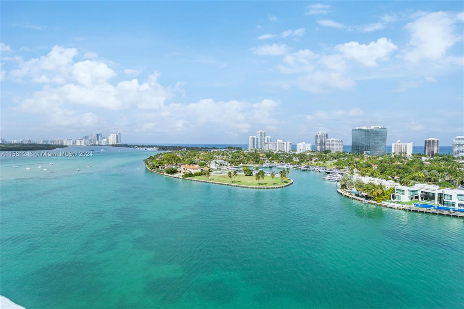 Indulge in the epitome of luxurious waterfront living. This unit presents a harmonious fusion of contemporary elegance & tranquil coastal allure. The expansive 3000 sq ft wraparound terrace offers awe-inspiring panoramic vistas of Biscayne Bay, Bal Harbour Yacht Club & Haulover Inlet. 2000 sq ft interior showcases exquisite high-end finishes, generous liv. spaces, open kitchen & stylish great rooms designed for both aesthetics & practicality. Spacious bedrooms & spa-like bathrooms provide a sanctuary of relaxation. This remarkable residence, crafted & owned by renowned architect, includes a deeded boat slip that can accommodate boats over 40 ft. granting direct ocean access. Enhancing the upscale lifestyle, enjoy a rooftop 60' lap pool, a rejuvenating spa tub, fitness center & steam room.