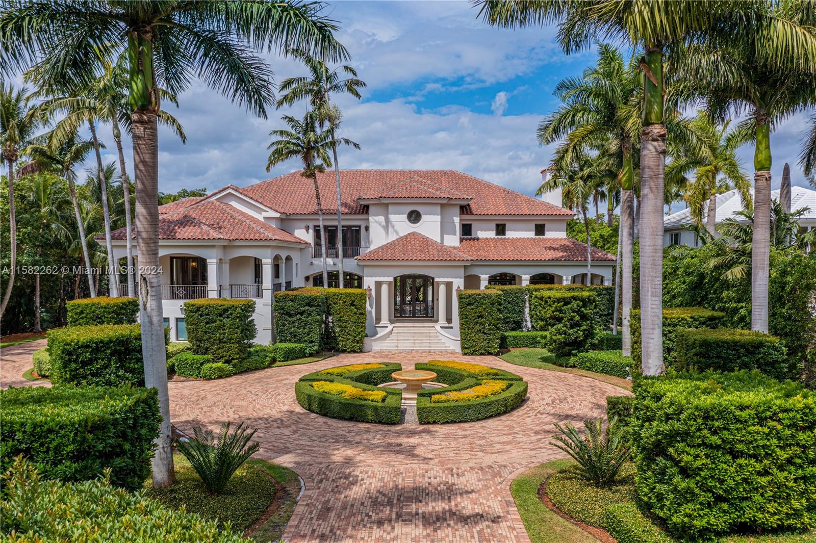 A one-of-a-kind, Mediterranean estate in the prestigious and private gated community of Tahiti Beach Island. Located at the end of a cul-de-sac, sitting on over an acre and featuring 25-foot-high ceilings in the foyer & living room. Perfect for entertaining, the large kitchen with wet bar and butler’s pantry leads to a light filled family room that opens to an extensive outdoor terrace, 24 x 40 pool and guest house. Boasting an opulent primary bedroom with dual closets, an oversized bathroom and a private balcony looking over the pool and yard.  Tahiti Beach Island offers a private beach, tennis courts, pickleball & access to all of Cocoplum’s amenities.