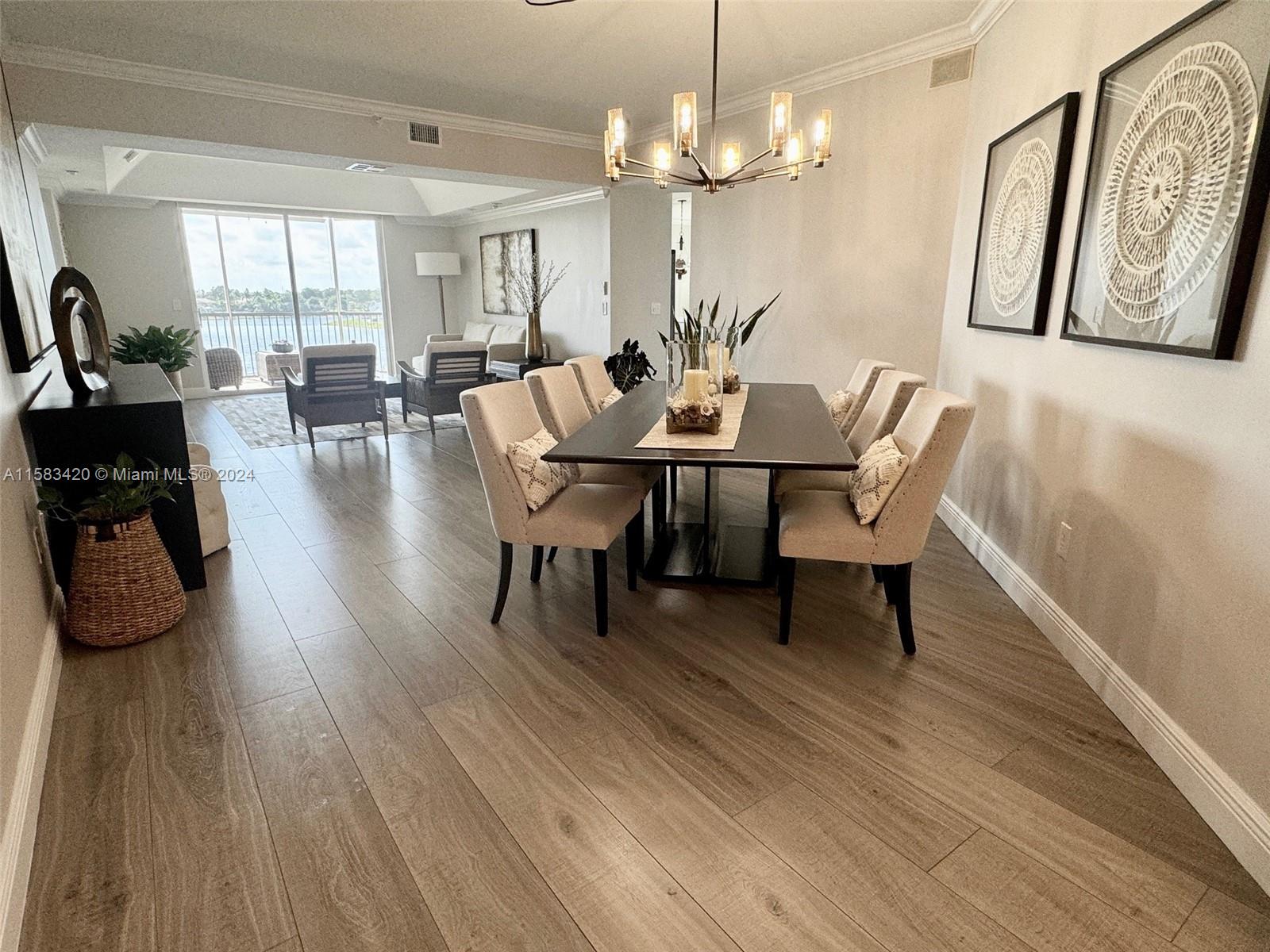 Living in a Luxury Resort Style exclusive community of Doral Isles. Spectacular Lake View condo with a great layout of 2,490 sqft  featuring over $150K in upgrades, 3 bedrooms, 2 baths, remodeled kitchen in 2022, brand new AC, fully replaced in 2023, new flooring throughout the entire unit, walking closets with tempered glass doors, motorized shade in the balcony, new washer and dryer, UV filters in all windows. See attachment for all the details. Beautiful Club House with all amenities including a new restaurant, fitness center, 3 pools, sauna, tennis courts, basketball court, soccer field, private beach with volleyball court, children playground, jogging trail....Just fall in Love!!
