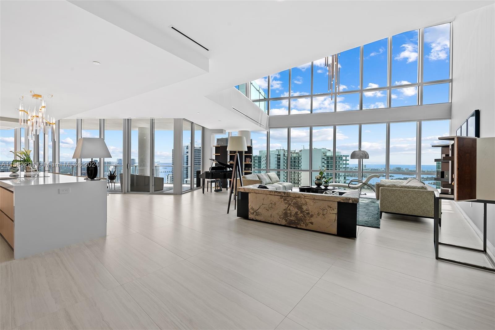 Located within Miami Worldcenter, the second largest master planned community in the U.S., PARAMOUNT Miami Worldcenter, the building with the most amenities in the world. This 6,513sq ft. (unfurnished) 5BD + Den + Office / 6.5Bath DUPLEX is AVAILABLE NOW, a must see!! Access to 46 different amenities such as 5 pools, spa, outdoor lounge, summer kitchen, game room, state of the art fitness center, boxing studio, basketball court, racquetball, yoga, observatory, jam room and recording studio and much more. Just steps from the Brightline Train Station, Port of MIA, Arena and minutes to MIA Airport, Wynwood, Miami Beach and so much more.**Furniture and art is not included in the price.