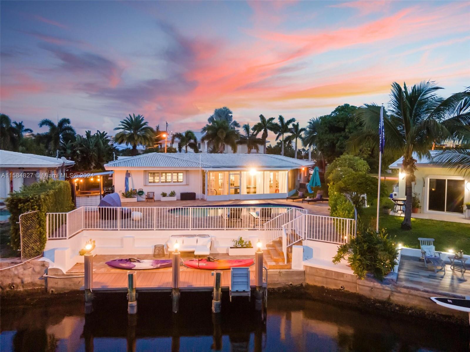 This stunning house offers one story, 3 bedrooms/2 bathrooms, a pool, a dock for boats of up to 35 feet, and incredible sunsets. The best long view of the channel, deep waters without fixed bridges. Sea wall and cement spring with an electric point and water. Terrific pool in front of the channel with a lot of relaxing space and an outdoor bar covered with a television. A screened game room next to the pool. Beautiful and spacious stylish new renovated kitchen. Both bathrooms are fully updated with newer dresses, bathrooms, and accessories, they look so elegant! Washing and dryer washing space next to the kitchen and storage space with the water heater in front of it. Attached garage with automatic door and sink. New asphalt on the driveway. Equal housing opportunities.