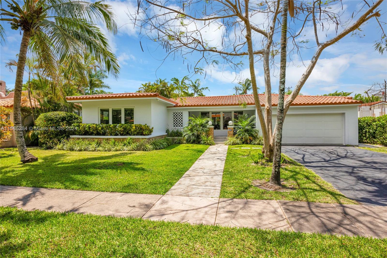 Ideally situated in the heart of Coral Gables, 2 blocks from the Granada golf course & a stone’s throw from downtown, this 4 br, 2.5 ba, 2,743 sf house on an 11,250 sf lot has been totally updated & meticulously maintained.  It features open & bright living spaces w/ light shining through new impact glass windows & drs, renovated kitchen w/ high-end appliances, custom cabinetry, & breakfast area.  The split floor plan finds the primary suite w/ new BA incl soaking tub & dual sinks to one side, w/ the remaining 3 br & redone full & half ba’s to the other.  The deep patio is accessed via French drs & steps out to the spacious lot that feels bigger than its size.  With a new roof from 2021, new a/c, full-house generator, pvc plumbing, 2 car gar and more, this house is perfectly move-in ready!