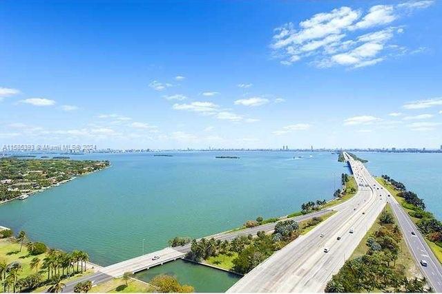 Spacious and bright unit with with wonderful. Limitless bay views. New floor just installed throught the unit. Floor to ceiling impact windows in living area and Master Bedroom. Convenient location with direct access to Miami Beach, Miami Airport, Design District, Midtown and Brickell.
Unit is Vacant and easy to show, Please call/text listing Agent. See broker remarks.