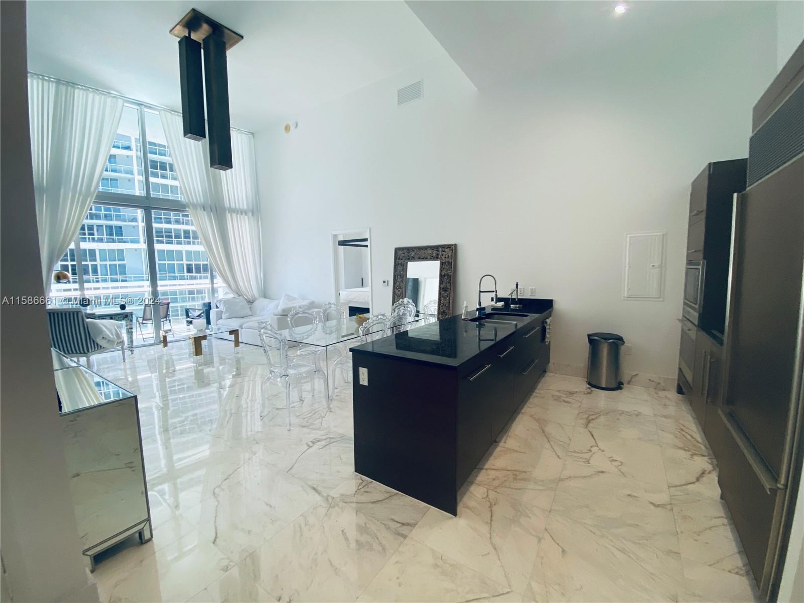 ABSOLUTELY STUNNING 16' CEILINGS 2BR/2BA + DEN... CUSTOM MARBLE FLOORING THROUGHOUT & DESIGNER OVERSIZED LIGHTING FIXTURES.. ENJOY SPECTACULAR VIEWS OVERLOOKING BISCAYNE BAY & THE ICON BRICKELL POOL. SUBZERO & WOLF & BOSCH APPLIANCES. ENJOY 5-STAR AMENITIES OF THE W HOTEL, INCLUDING STATE OF THE ARTS FITNESS CENTER (WORK OUT CLASSES ALL INCLUDED) , INFINITY POOL WITH TOWEL SERVICE, LUXURY SPA TREATMENTS, CIPRIANI'S, CANTINA VIENTE ALL ON PREMISES. WALKING DISTANCE TO BRICKELL CITY CENTER, ENDLESS RESTAURANTS, SHOPPING AND THE MIAMI FINANCIAL DISTRICT.
