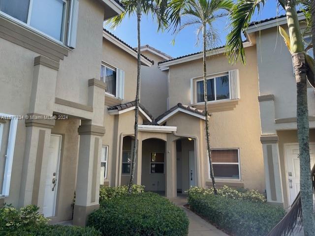 COZY 2 BR/2.5 BA TOWNHOME W/ TILE AND LAMINATE FLOORING THROUGHOUT.   SMALL FENCED IN PATIO.  NO NEIGHBORS TO THE REAR.  IN PROCESS OF BEING PAINTED. RENT INCLUDES DIRECT TV CABLE & INTERNET, ALARM MONITORING, EXTERMINATOR, GUARDED ENTRY, ROVING SECURITY & POOL. Quick HOA approval