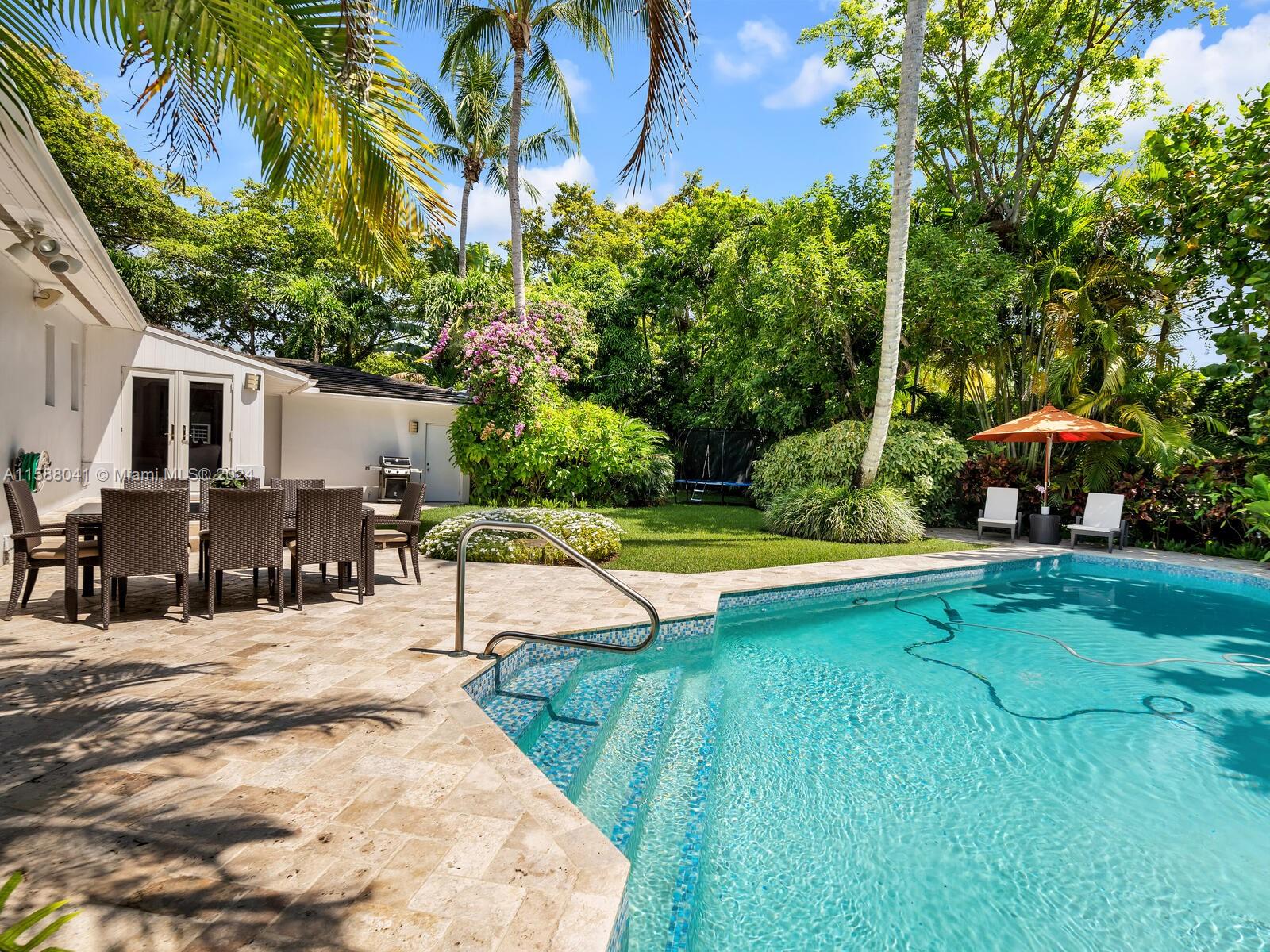 Welcome to 6601 Santona St, a perfectly located Coral Gables gem on a lush 15,000 sq ft corner lot! This charming one-story residence offers 3 large bedrooms with plenty of light, 3 baths, and a cozy den. Step outside to your spectacular garden with an oversized pool offering  perfect privacy, great for entertaining and relaxation. Additional features include Oak floors, impact windows, crown molding and chair rails, 2 walk-in closets, 1.5 car garage with EV charging station, and a full home generator to ensure peace of mind. Prime location in Sunset Elementary school district. Very close to UM, Rivera school, Whole Foods, Publix, Metrorail, William H Kerdyk and Jaycee Parks, dining and entertainment. Don't miss this rare opportunity!