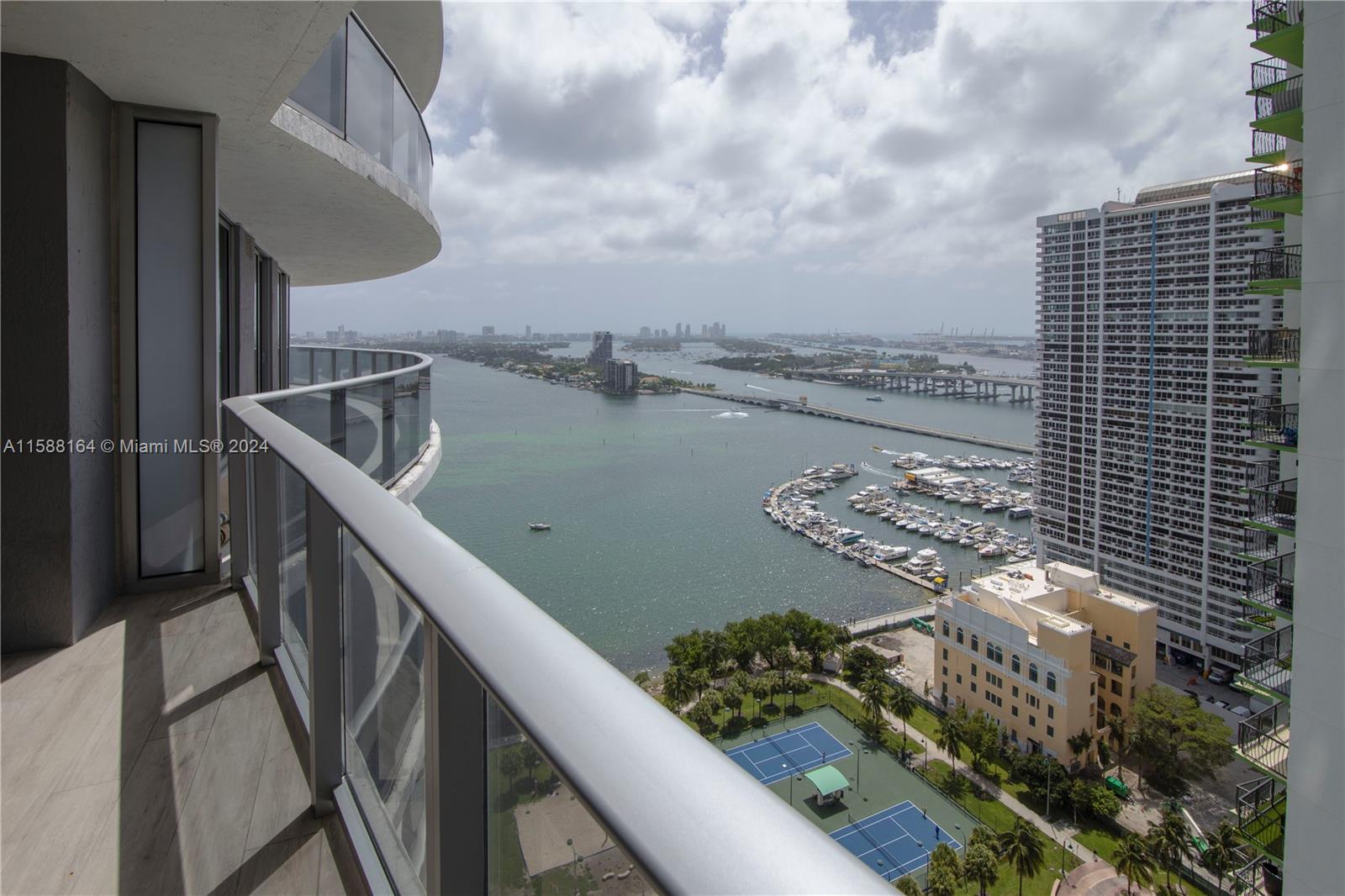 Breathtaking water views of Venetian Causeway and Miami Beach Skyline. Designer decorated contemporary furnished 3 bedrooms /3.5 bathrooms apartment at Aria on the Bay. Spacious apartment with upgraded open European Style kitchen with Bosch appliances, full size washer & dryer, ceramic floors, build in European closet cabinets, electric blinds. Large wrapped around balcony. Private elevator foyer for the unit. Aria on the Bay is a luxury condominium full of amenities: 2 Pools, Gym, Yoga Room, Sauna, Jacuzzi, Pool Table, Kids Playroom, spacious social areas, 24 hours security and lobby attended, valet parking. Located in the Edgewater neighborhood walking distance to Miami's Art and Entertainment center, Margaret Pace. Close to design district, Miami Beach, and Brickell. Easy to access I95
