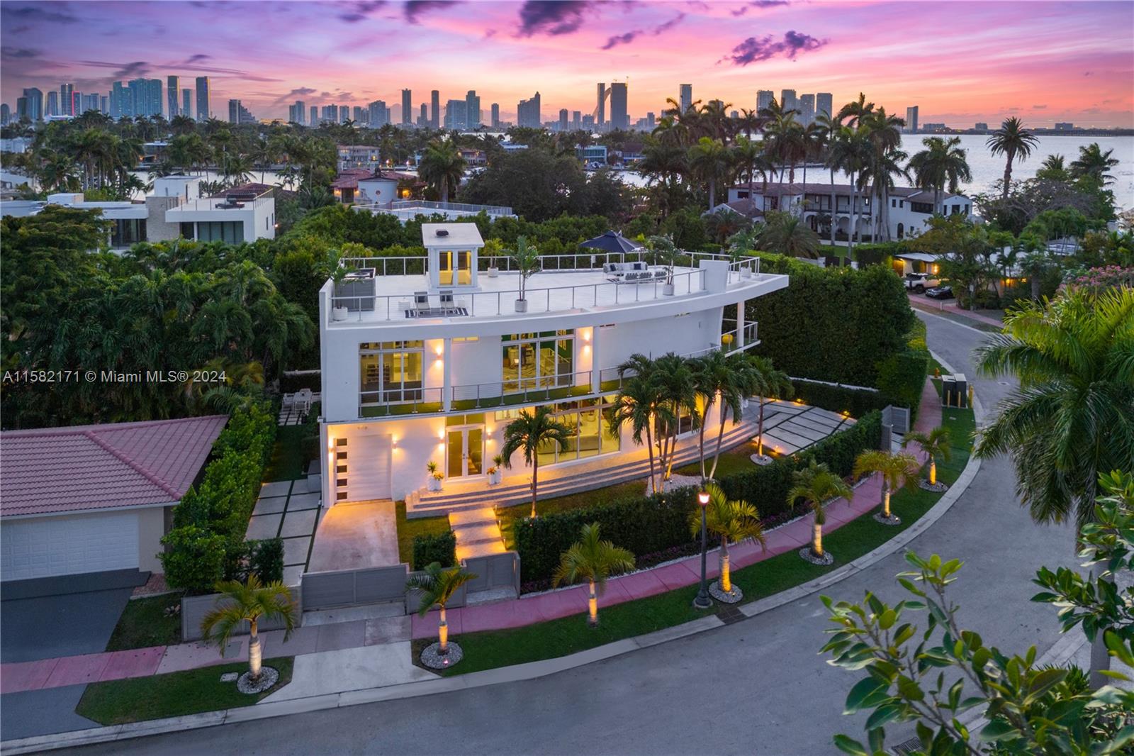 Welcome to Casa Sails, Your Modern Sanctuary Surrounded by a Lush Oasis in Miami Beach's Most Desirable Neighborhood -The Venetian Islands. Elevated 10' with 5,860 Total SF This 5-Bed, 5.5-Bath Masterpiece Features Sleek Lines Reminiscent of a Grand Sailboat. The Open Concept Layout, Smart-Home Technology, Top-Notch Sound System, and Nearly 100 Window Panels with Advanced UV Protection Create a Home with Great Energy! Dedicated Police Patrol & 24/7 Camera Security, Safety Is Unmatched. Two Extended Driveways & Garage Accommodate 5 Cars, While the Pool and Backyard Sanctuary Offer True Tranquility. Enjoy 360 Degrees Views from the 1,800 Sq Ft Rooftop with Incredible Views of Sunrises & Sunsets. For the complete video experience, please explore the virtual tour or book in person today!