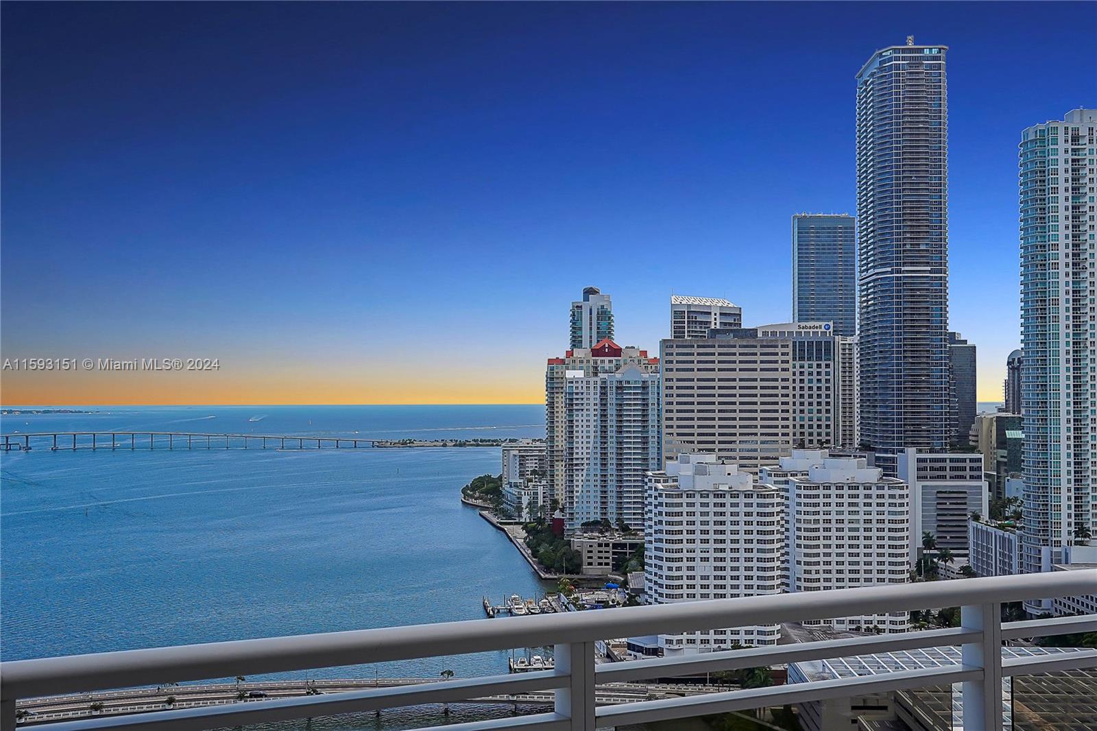 The best and most dramatic line in luxurious Carbonell on exclusive Brickell Key Island. High ceilings. Enjoy island life with 180 degree views from the entire west side of the building which offers open bay and breathtaking city skyline views from this 32nd floor unit. Floor to ceiling windows with 2 balconies on each side. Split floor plan offers privacy for every bedroom. Top amenities including 2 tennis courts, golf putting area, indoor racquetball court, indoor basketball court, heated swimming pool great for lap swimming, jacuzzi, BBQ area, private childs playroom, party room, conference room, computer room, 2 story gym with the latest equipment. Brickell Key offers top amenities with a short bridge leading you from private island life to exciting restaurants and nightlife.