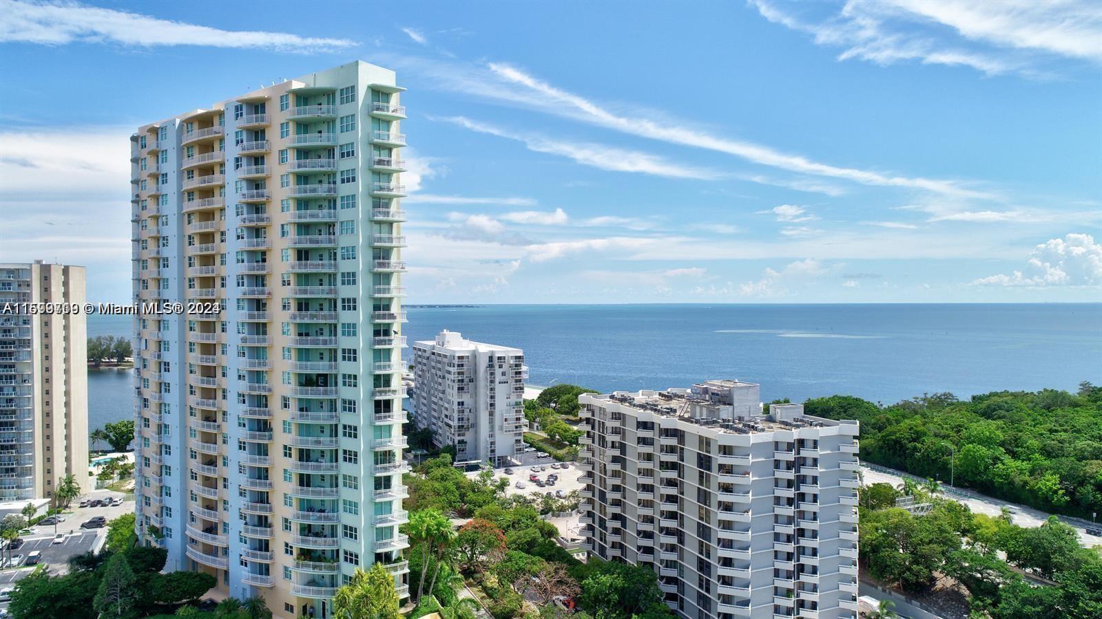 Stunning Corner Unit with Panoramic Views. Beautifully renovated 2 bed, 2 bath corner unit with spectacular views of Biscayne Bay, Vizcaya, and Key Biscayne. Features include high ceilings, marble floors, granite kitchen countertops, custom wood cabinets, remote-controlled Hunter-Douglas blinds, and new A/C unit. Enjoy two private balconies, spacious walk-in closets, and two assigned parking spaces. Building amenities: 24-hour security, free valet parking, pool, sauna, gym, business center, kids playground, washer and dryer in the unit, business center basic cable included in rent, business center, party room with kitchen and much more. Prime Brickell location, walking distance to downtown and restaurants.