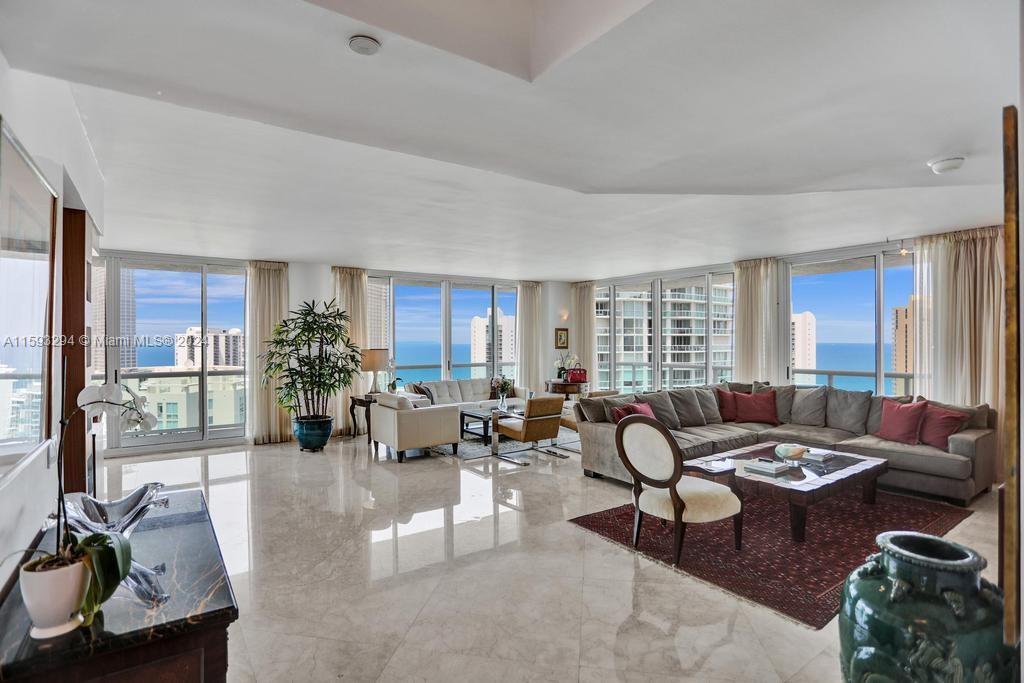 THIS SPECIAL CORNER PROPERTY IS IN OCEANIA ISLAND IN SOUGHT OUT AREA OF SUNNY ISLES BEACH. IT HAS BREATHTAKING VIEWS OF THE OCEAN, INTRACOASTAL, AND CITY THROUGHOUT. THIS RESIDENCE BOASTS 2,384 INDOOR SQ FT AND A HUGE WRAPAROUND BALCONY. RENOVATED "OPEN" STATE OF THE ART KITCHEN, MARBLE FLOORS, CUSTOM FINISHES, PRISTINE & JUST PAINTED. READY TO MOVE IN! ENJOY THE UNSURPASSED LIFESTYLE OF OCEANIA WITH CLUBHOUSE, CAFE, POOLS, BEACH SERVICE, MULTIPLE RESTAURANTS INSIDE & OUT, GYM, & SALON. A BOATER'S DREAM ON A PRIVATE ISLAND WITH A MARINA AND SO MUCH MORE!