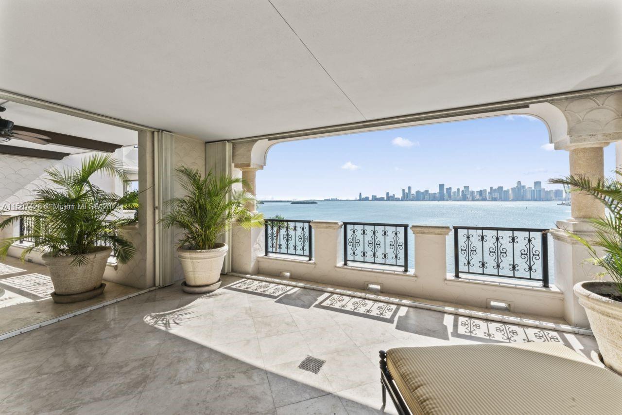 Welcome to an exclusive Fisher Island residence in Miami Beach, the only home on its floor, offering unparalleled privacy. Enjoy breathtaking sunsets and stunning Miami skyline views from the expansive private balconies. This pristine, move-in ready residence features an elegantly designed living room bathed in natural light, offering panoramic vistas from all spaces, including all three bedrooms. The gourmet kitchen, a chef’s dream, boasts top-of-the-line appliances and granite countertops. Relax in the luxurious pool area overlooking the bay. The property includes a rare 9x18 air-conditioned storage unit. Located in one of the world's most desirable country club communities. Luxury Island Living at its finest. Serious Seller & Easy to show, contact your island insider today.
