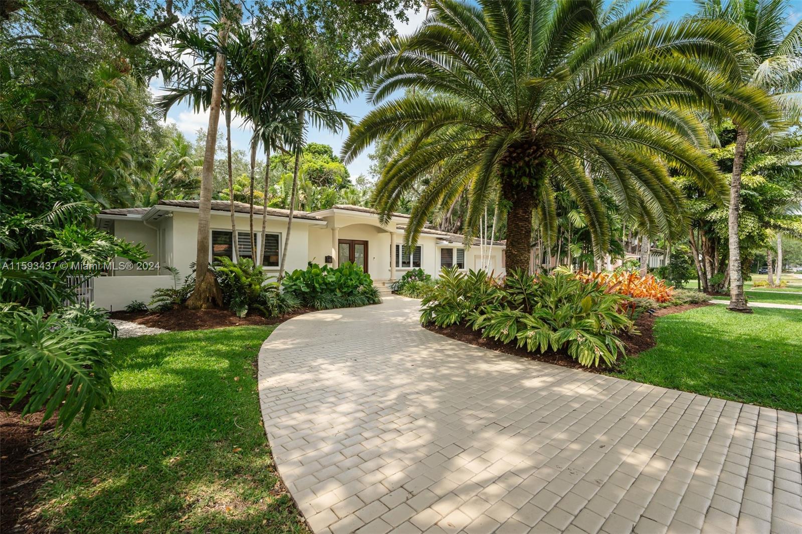 Stunning and chic, this 3,400 sq. ft Coral Gables gem sits in the prestigious Riviera Country Club neighborhood, close to UM & top schools. With 5 bedrooms,4 baths, it boasts numerous versatile living spaces opening up to an inviting & ample porch overlooking a large, heated pool and spa, surrounded by exuberant tropical mature trees. Beautiful resilient Dade County pine floors easily sanded out, and a majestic wooden staircase to the Master exudes character & quality.  Professional kitchen w granite countertops is equipped w commercial graded gas stove & exhaust with ample storage. Impact windows and doors, automatic generator, all copper and pvc plumbing, highest hurricane graded roof frame, auto leak detector, updated electrical panels, well sourced sprinklers & a smart Security System.