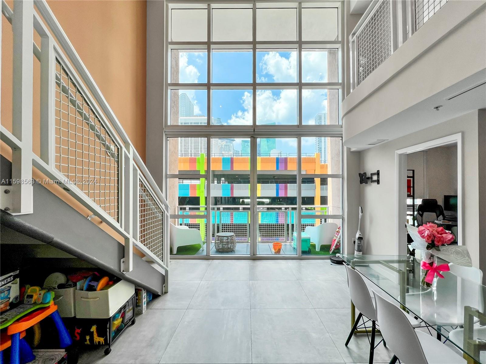 Welcome to this stunning, two-floor loft in the prestigious Vizcayne South Tower. This modern, spacious unit features 2 bedrooms, 1 den, 1.5 bathrooms, granite countertops, stainless steel appliances, in-unit washer and dryer, and its own storage space. The Vizcayne South Tower offers unparalleled amenities, including three pools, a Jacuzzi, a sauna, a gym, a cold plunge, massage rooms, and fitness classes. Perfect for investors, the unit can be rented up to 12 times a year. Enjoy the ultimate convenience with your parking spot right next to the unit, allowing for easy access as if walking into your own garage. Located near the American Airlines Arena, Wynwood Walls, and local shops and diners. Schedule a showing today and experience luxury living at its finest!