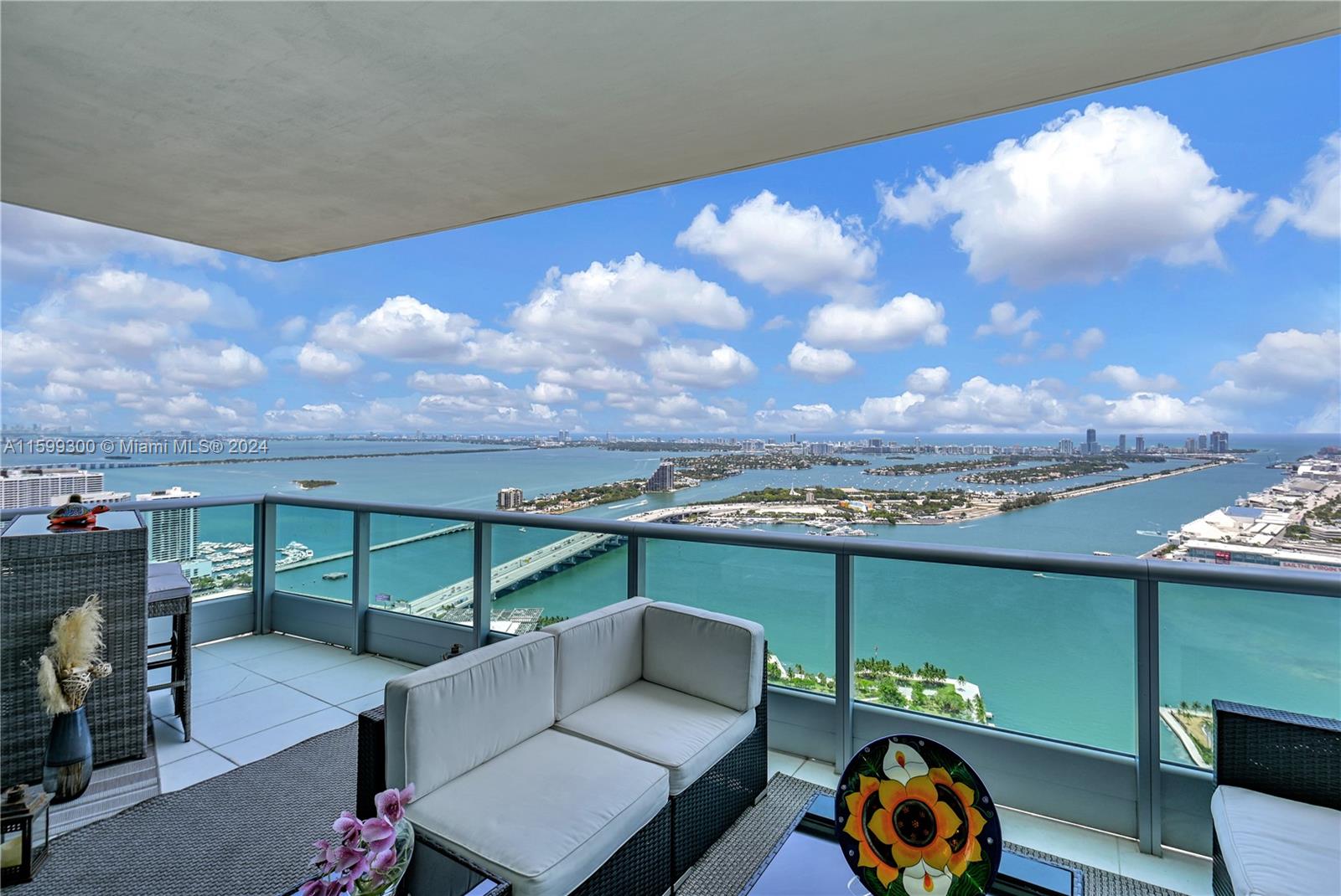 Breathtaking view unit on 56th floor fully furnished. Amazing panoramic view of ocean,intracoastal,miami beach and key biscayne. Excellent location boasting 5 star amenities, walking distance to popular restaurants, drugstore, supermarkets, metro mover and much more. This unit is a 1 bedroom plus den with 2 full baths including italian glass flooring throughout, custom built-ins in den and closets, kitchen with subzero and miele appliances, 2 TV's with cable and high speed internet included. Washer/dryer also in unit. Building amenities include fitness center, theater, lounge, 2 clubrooms plus conference room and kids play room. Spa includes his/hers areas with lockers, sauna, hot tubs and showers. Lots of storage in unit.