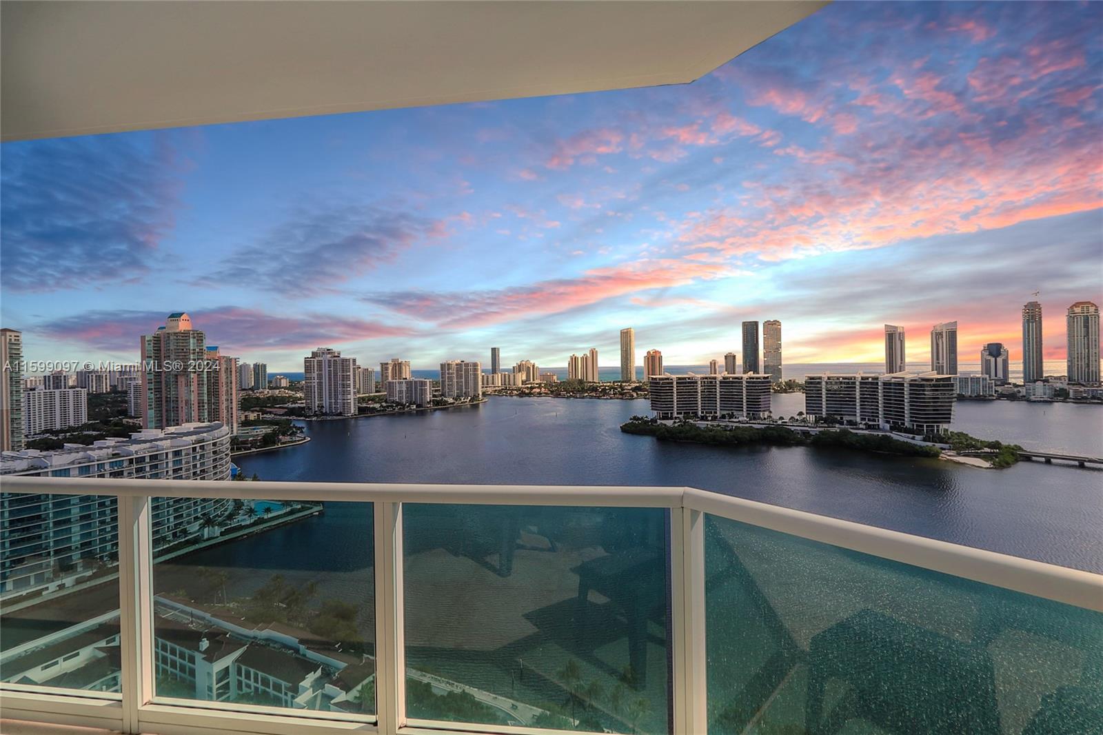 The most premium line in the building is for a large 3 bedrooms with 3.5 bathrooms plus a media room. Flow through layout with an open kitchen, that leads to a separate formal dining area. Den can be used as an additional guest room, office, or media room. Enjoy beautiful sunrises and ocean & bay views from your large balconies. Large master bedroom with private balcony and walk-in closet, separate laundry room. Peninsula is a full-service luxury building with 24-hour security. The lobby has been fully renovated. Complementary valet parking, 2 swimming pools with towel service, Two fitness centers, 3 tennis courts, a game room featuring billiards, ping pong, dog walking area plus a private dog park, excellent location, near Aventura Mall, great schools, near shopping & restaurants.