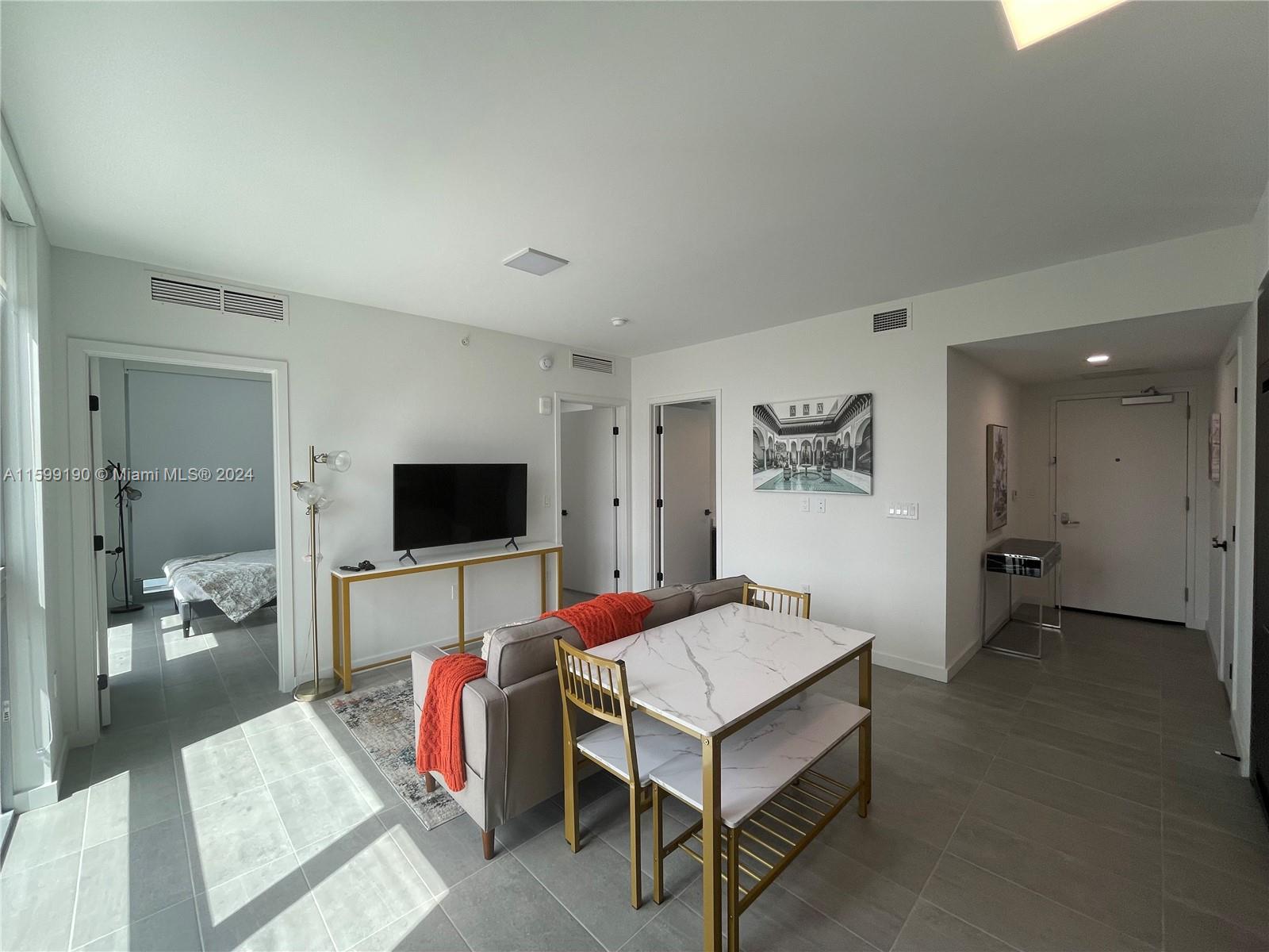 Welcome to Downtown Miami. This 2 bedroom 1.5 Bath fully furnished apartment is located within walking distance to Bayfront Park and many of the sights and sounds of the city. Enjoy a hotel pampering experience, 24/7 gym, pool, restaurant, bar, and jacuzzi spa. You will be 15 min from lots of neighborhoods such as Wynwood, Brickell and Design District. Also conveniently located near to Miami Beach and the Miami International Airport.This stylish place is close to must-see destinations.