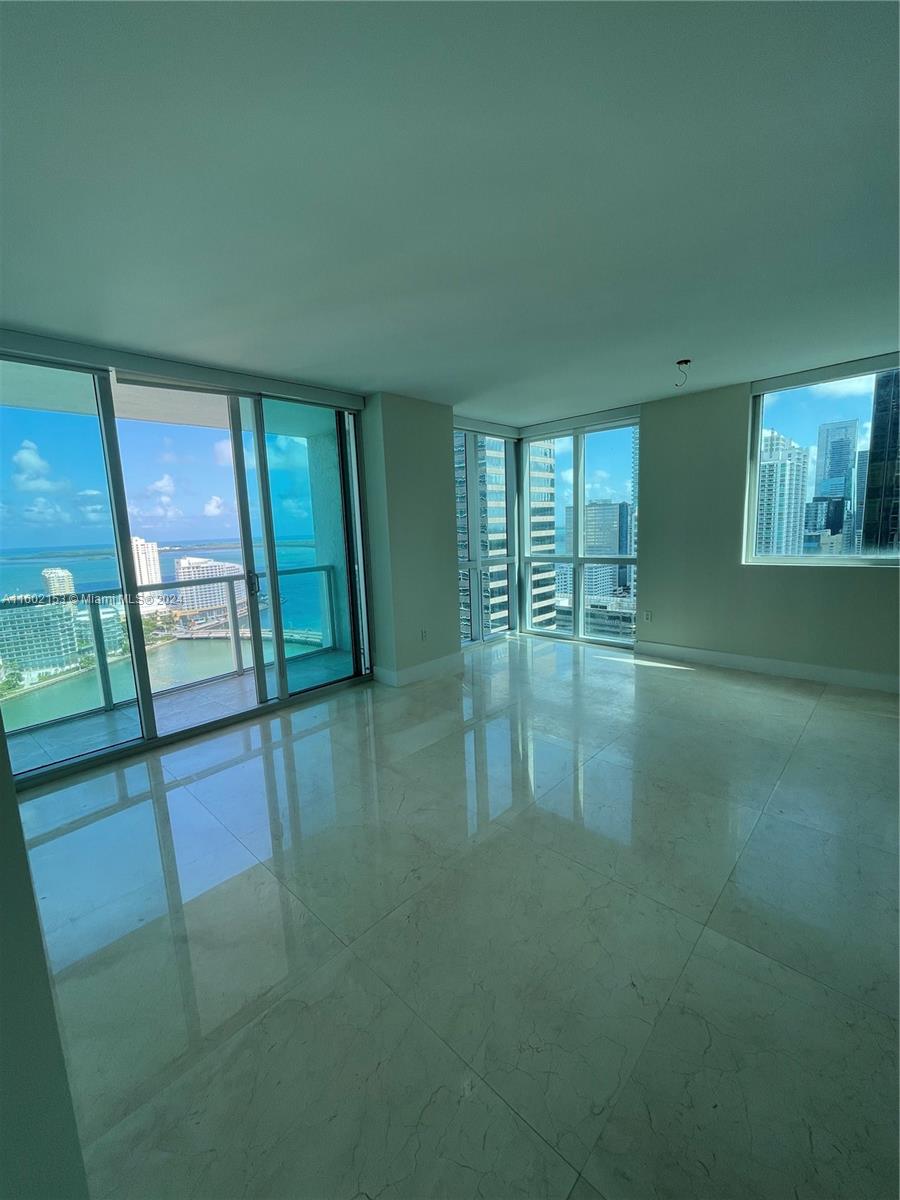 500 Brickell East Tower. Corner unit with amazing Bay and Ocean views and breathtaking sunrise settings. Bright, Spacious and Quite, is what best describes this unit on the 32nd floor facing South East. Marble floors throughout 36" x 36", Open kitchen, formal foyer, Great terrace, freshly painted with attention to details. Full service building with great amenities, security and much more. Maintenance includes mandatory FULLY RESERVES