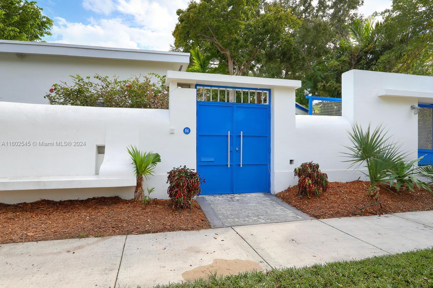 Ultra-private, walled & gated Miami-Modern style home in the exclusive Bay Heights neighborhood of Coconut Grove. 24/7 police patrol. Light-filled living spaces with vaulted & beamed ceilings, hardwood flooring & banks of French doors opening to the garden. Ideal floorplan features open layout, 4BR/3BA and custom kitchen w/wood cabinetry, stone countertops & stainless appliances. Large primary suite offers walk-in closet & luxurious marble bath w/ soaking tub & separate shower. Updates include new: roof (2022), HVAC, water heaters, exterior painting, artificial turf, plantation shutters & custom window shades throughout. Free-standing, 600 SF 2 CG w/potential to become additional living space. Enjoy outdoor living and entertaining on the expansive terrace surrounding tropical pool &​​‌​​​​‌​​‌‌​‌‌‌​​‌‌​‌‌‌​​‌‌​‌‌‌ spa.