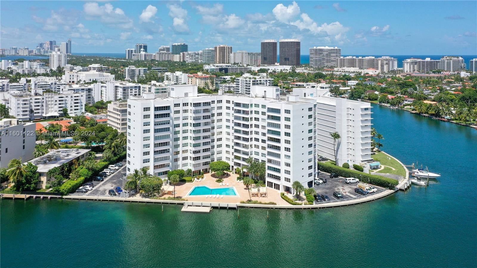 Spectacular and spacious unit at The Blair House in Bay Harbor Islands with breathtaking views upon entering. Updated 1820 SF apartment with two bedrooms, 2 full bathrooms and powder room. Enclosed den, or storage space inside unit, and additional storage closet outside of unit. Beautiful natural light all day and incredible views of Biscayne Bay, Miami Beach Skyline and Indian Creek golf course from every room. Concrete walls, porcelain floors, stainless steel appliances. Washer and dryer inside the unit. Beautiful boutique building minutes away from the beach and Bal Harbour Shops. "A" rated K8 Public School two blocks away. Bicycle and kayak storage.