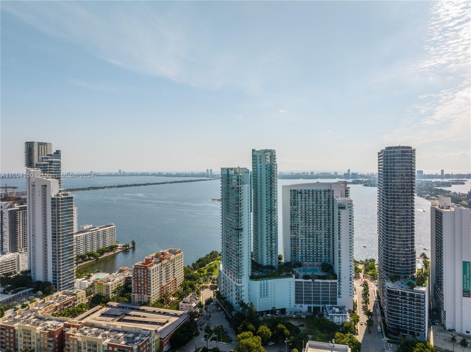 Extremely desirable Edgewater Bayfront corner unit offered with two side-by-side parking spaces. Vynel floors throughout this 2/2 at QUANTUM ON THE BAY. Stunning skyline views of Miami from this spacious unit with an open floor plan, floor-to-ceiling impact windows & doors, a walk-in closet, Italian cabinetry, stainless steel appliances, natural stone countertops, & washer/dryer! Enjoy sunsets from your SW-facing wraparound terrace. Relax in the two pools, sauna, or resident lounges, and take advantage of the two fitness centers and business centers. 24-hour security, valet parking, convenience store, and salon! Minutes from Wynwood, the Design District, museums, Publix, and Metro. Pet-friendly building facing Margaret Pace Park.
