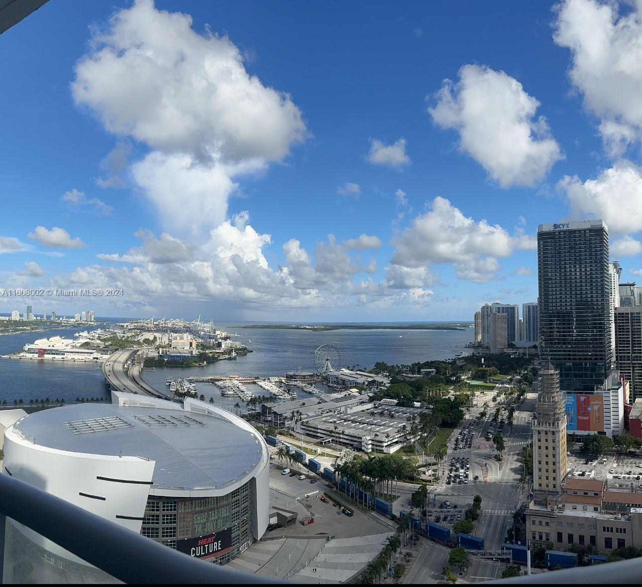 Amazing 1-bed, 1.5-bath unit with Den at Marina Blue Condo,  in Downtown Miami. Spacious Balcony with Spectacular view of Biscayne Bay & Miami Beach.The interior features marble flooring, half bathroom, walk-in shower in master bathroom, and washer and dryer. An assigned covered parking space makes your vehicle easily accessible! The luxury building has a social deck at 14th floor with 2 pools, grill area, beach sand volleyball court, Jacuzzis, 24-hour security, fitness center, and more. Location offers easy access to Brightline Station, near Kaseya Center, Miami World Center, Bayside, Bayfront Park and highways for quick access to South Beach. This meticulously designed residence offers a perfect blend of sophistication and comfort. Currently tenant occupied until March 2025.